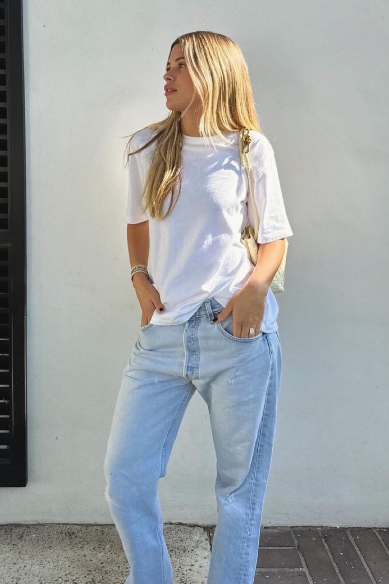 Sofia richie style
Celebrity style
Baggy jeans
Oversized white t-shirt
Street style
Bottega andiamo bag for less

#LTKfindsunder100 #LTKitbag #LTKfindsunder50