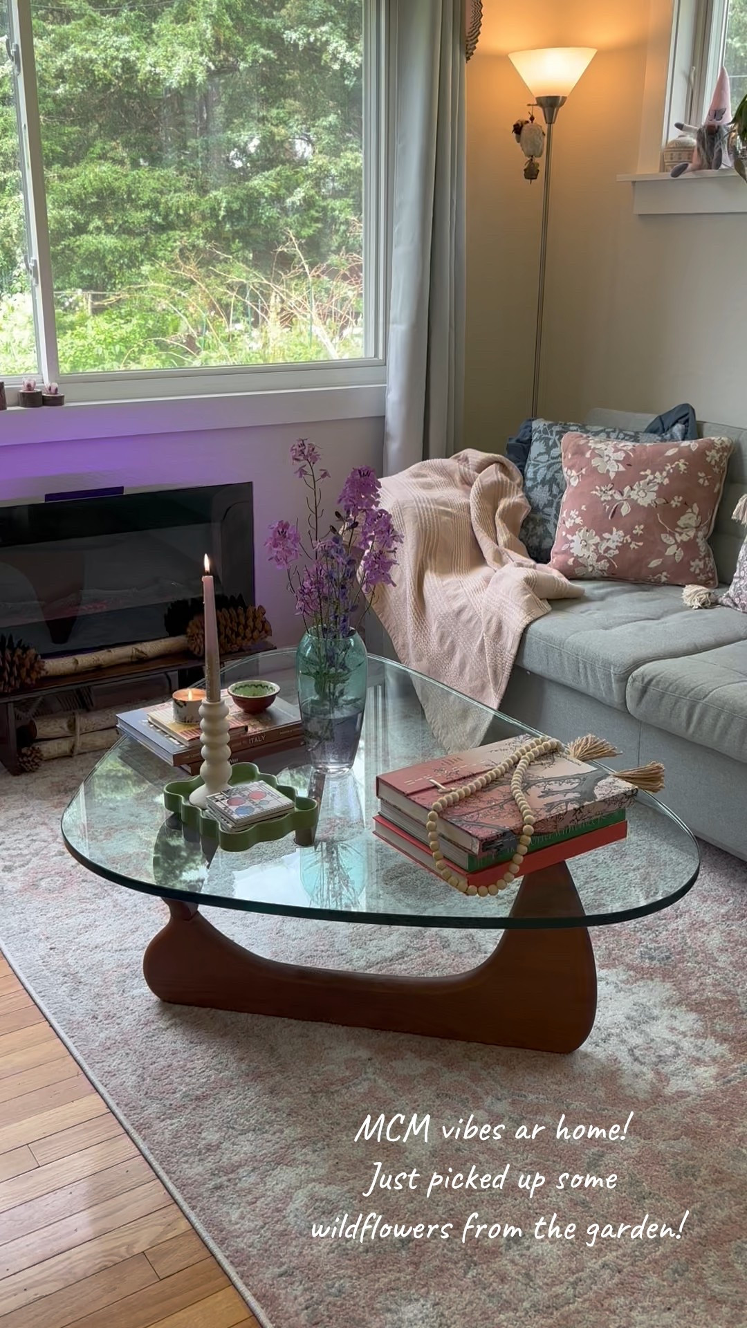 Mid-century Modern vibes at home! Rearranged the furniture a bit, still loving my Noguchi-style coffee table and this electric fireplace! #homedecor #livingroominspo #livingroomdesign 

#LTKFamily #LTKStyleTip #LTKHome