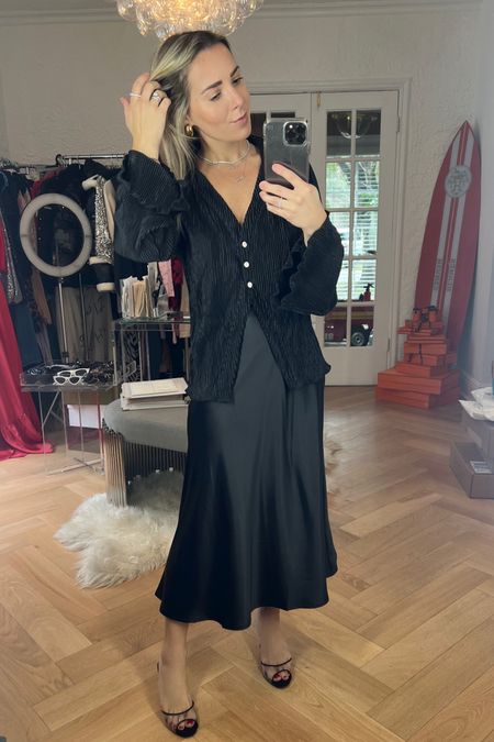 How cute is this black amazon silk skirt? It’s such a classic and versatile piece and can be styled with a blazer belted like I did in my previous LTK post, an oversized sweater, or a fun amazon top like this one! This black button down top is perfect for date night or a girls night out. Sizing is true to size. 

#LTKfindsunder50 #LTKU #LTKstyletip