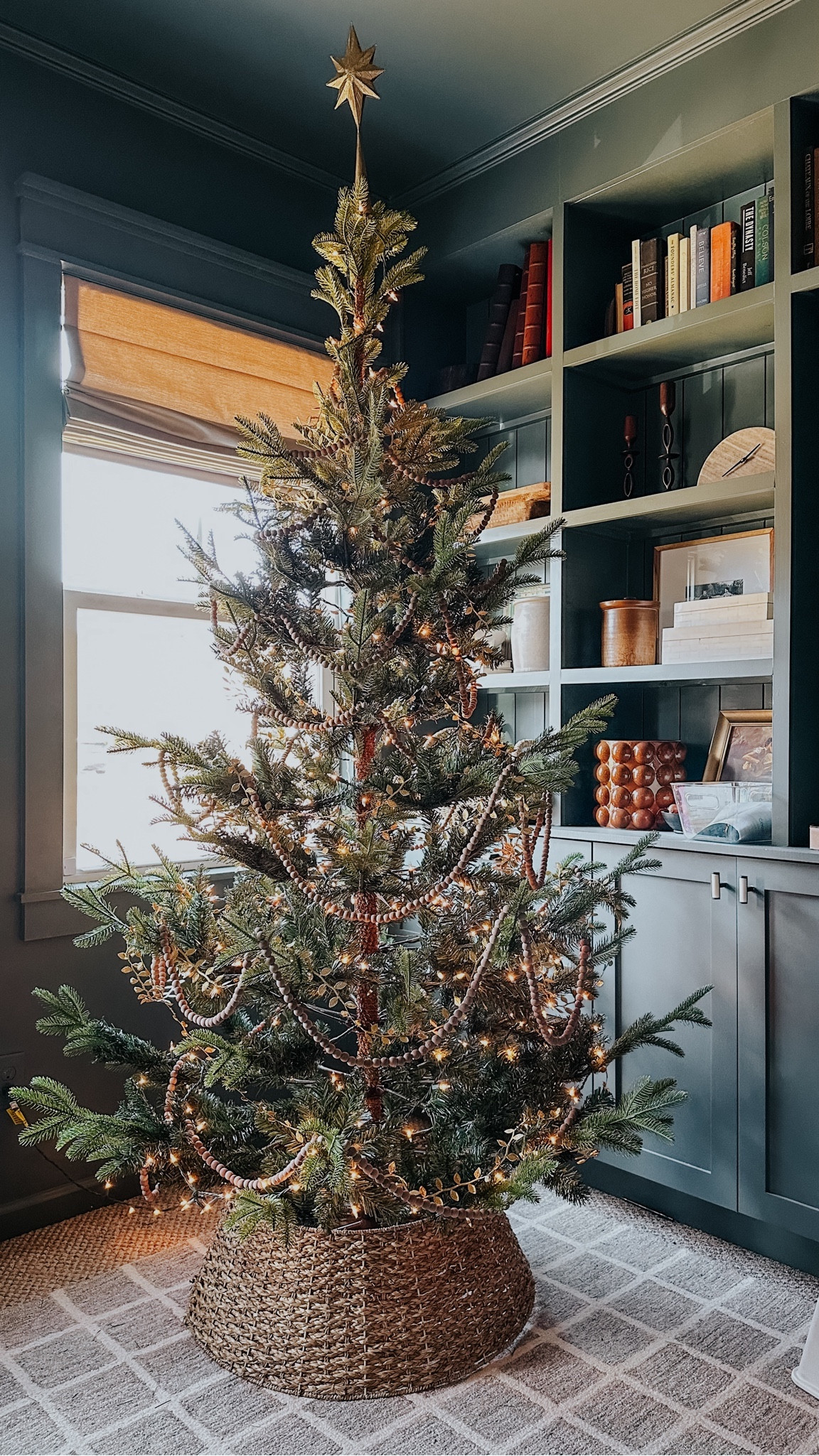 Real feel tree, gold leaf garland, wood bead garland, woven tree collar 

#LTKhome #LTKHoliday #LTKSeasonal