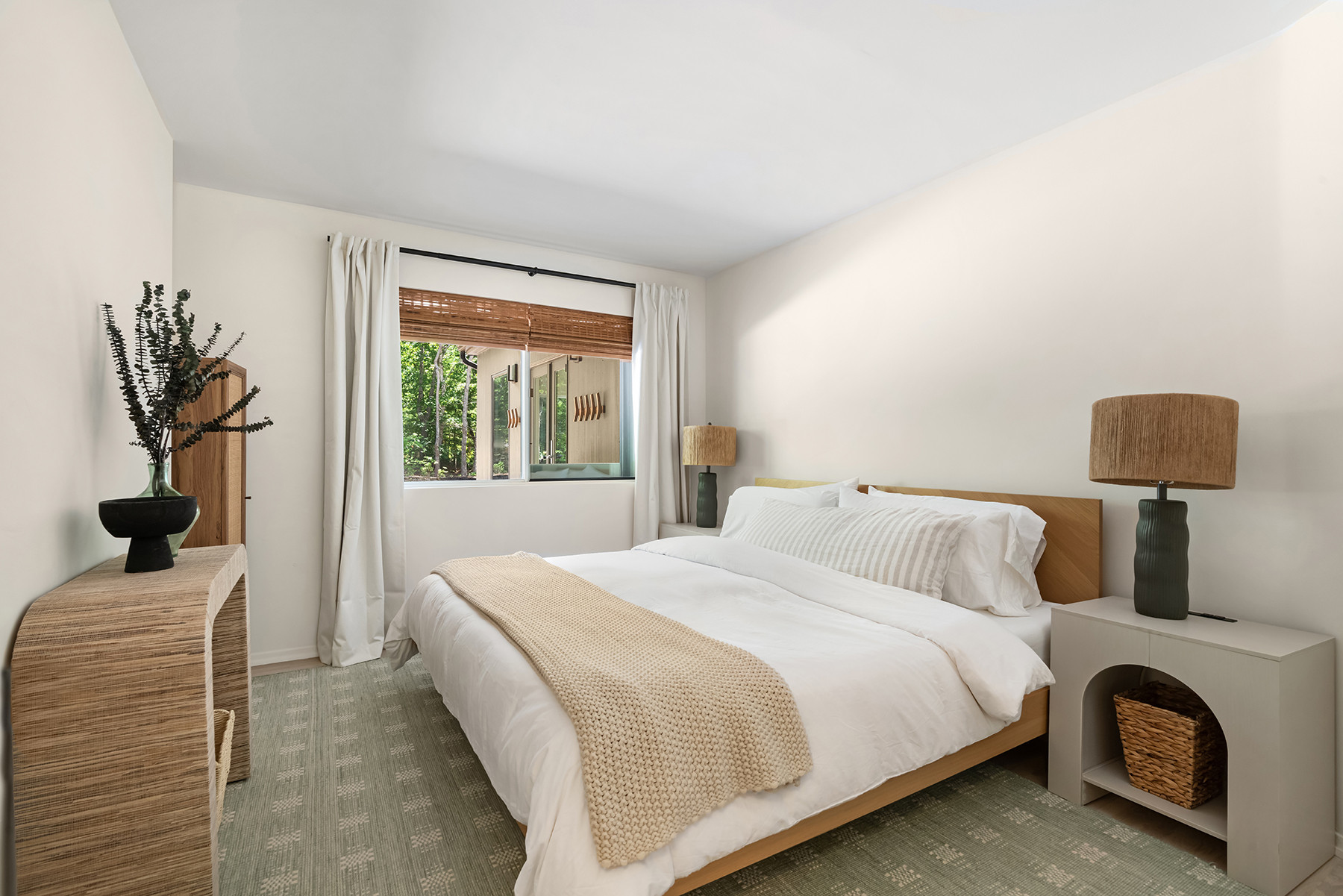 One of my favorite bedroom formulas: blackout curtains + woven shades, warm wood furniture, crisp white bedding, and soft neutral layers. It feels elevated without overcomplicating the space.

Linking the exact and similar pieces here.

#LTKHome #LTKSaleAlert