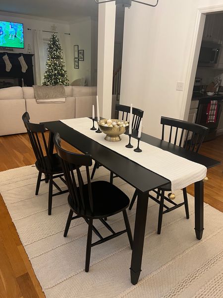 Black dining room table and chairs with handmade wool rug 

#LTKhome