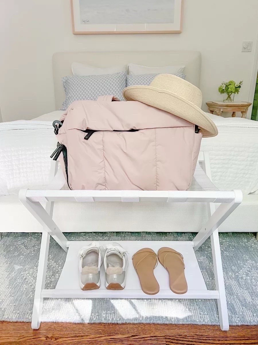 One of my favorite recent additions to our refreshed guest room is this luggage rack. Not only is it nice for guests, but I also use it when packing and unpacking my own bag!
-
coastal home decor, coastal style, coastal bedroom, bedroom decor, duffel bag, overnighter, luggage, calpak luka duffel, travel bag with pockets, carryon bag, travel essentials, upholstered bed, pottery barn bed, cayman upholstered bed, white beds, platform bed, guest bedroom decor, white luggage rack, blue and white rugs, serena and lily rugs, coastal sheet sets, tj maxx sheets, blakely rug, summer bedding, white quilt, pottery barn quilt, folding luggage rack, bedroom wall decor, coastal artwork, beach artwork, surfer artwork, beach house artwork, cotton linen quilt, white waffle weave bed blanket, amazon bed blanket, amazon bedding, pottery barn bedding, beach hat, sun hat, white sneakers, walking sneakers, sneakers for italy, TKEES sandals, minimalistic sandals, straw hat, white linen euro shams, amazon euro shams, tan sandals, amazon sandals, blue & white bedroom, white leather sneakers

#LTKHome #LTKTravel