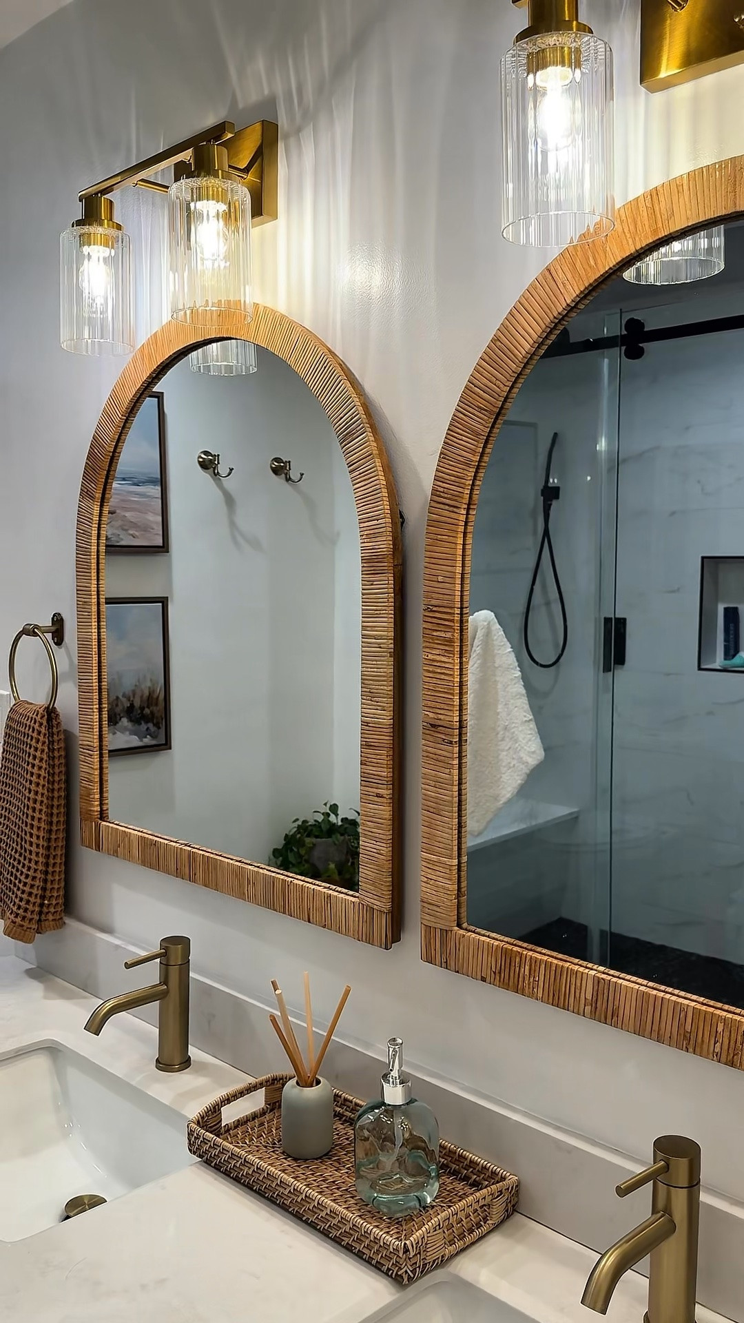 You don’t have to demo your cold white bathroom to make a difference! I found everything on Amazon!!

Just swap out old to new:

- brushed gold faucets
- rattan framed mirrors
- brown or beige waffle towels
- brushed gold vanity lights
- wooden storage cabinet
- wooden accent table + greenery

#bathroommakeover #bathroomrefresh #homeimprovementideas

#LTKHome #LTKOver40 #LTKSaleAlert