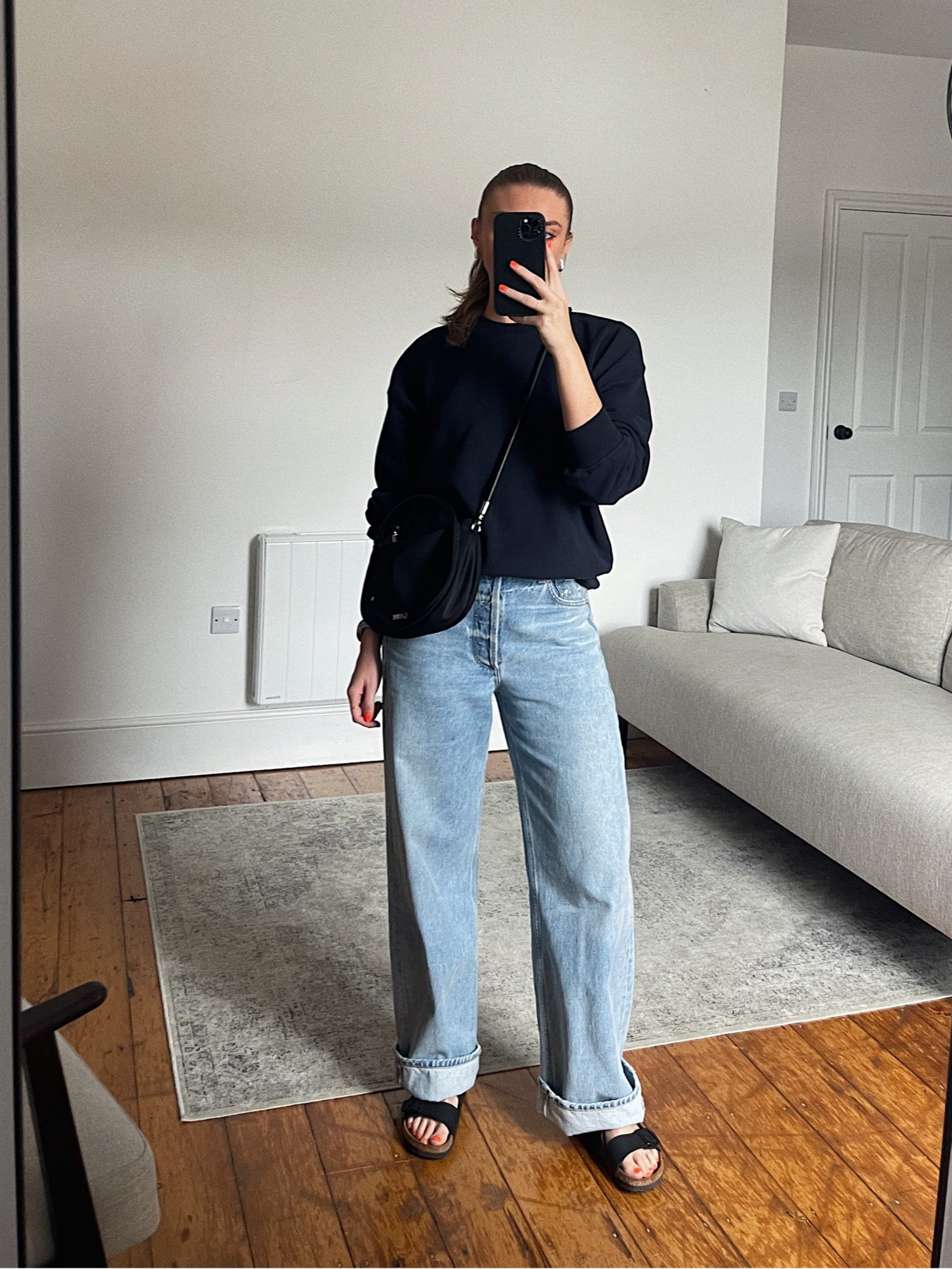 Raey navy sweatshirt, I wear the UK 8 
Citizens of humanity Ayla jeans, I wear the W25, I’m 5ft 6 
Ganni bag, EMILY15 for 15% off the bag via Coggles 