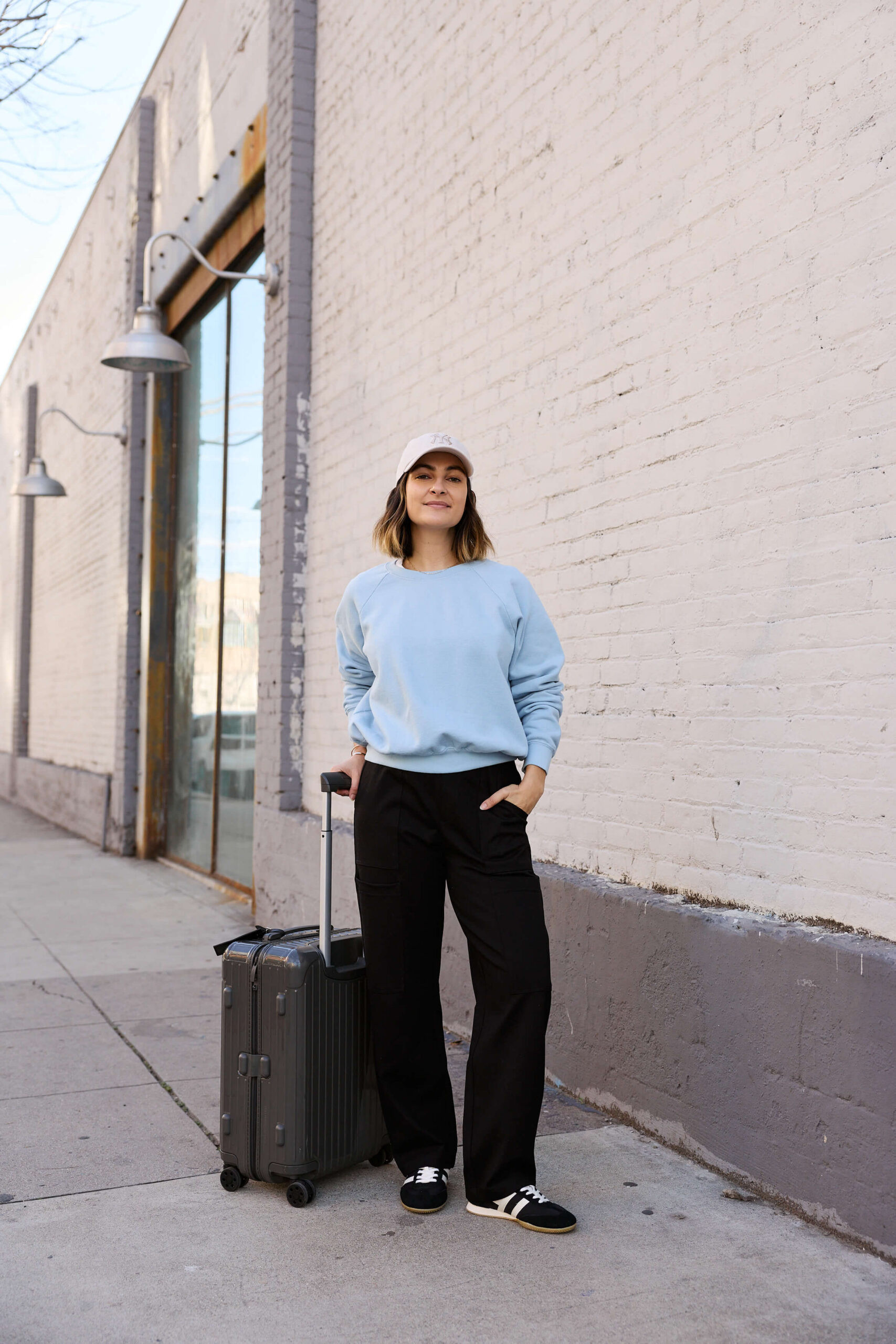 My go-to travel outfit: a staple sweatshirt, elevated pants that are still comfortable, and my favorite go-with-everything sneakers.  

 #LTKootd #LTKTravel