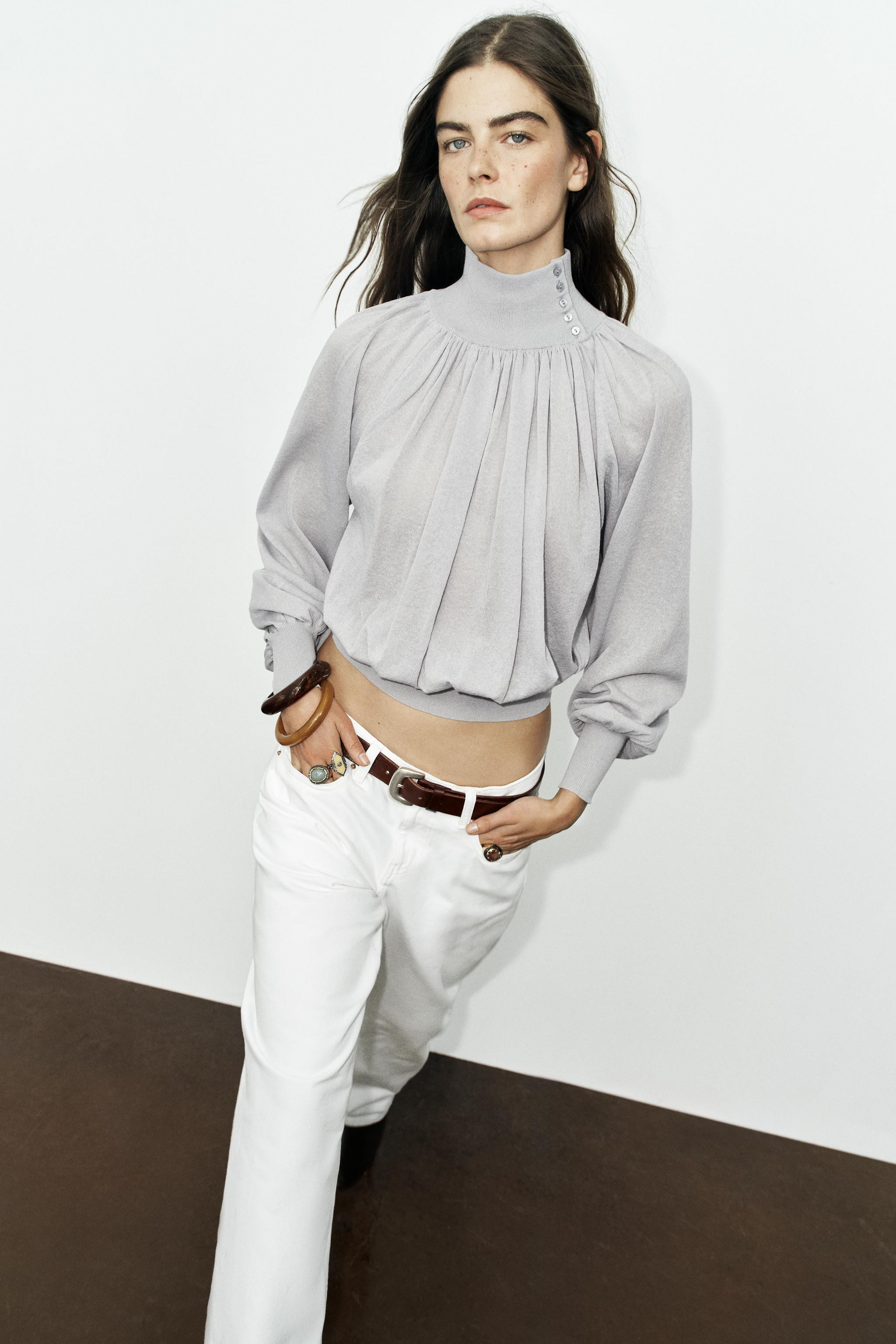 High-neck blouse with button closure and long sleeves with cuffs. Features a mixed-fabric design. | Zara US