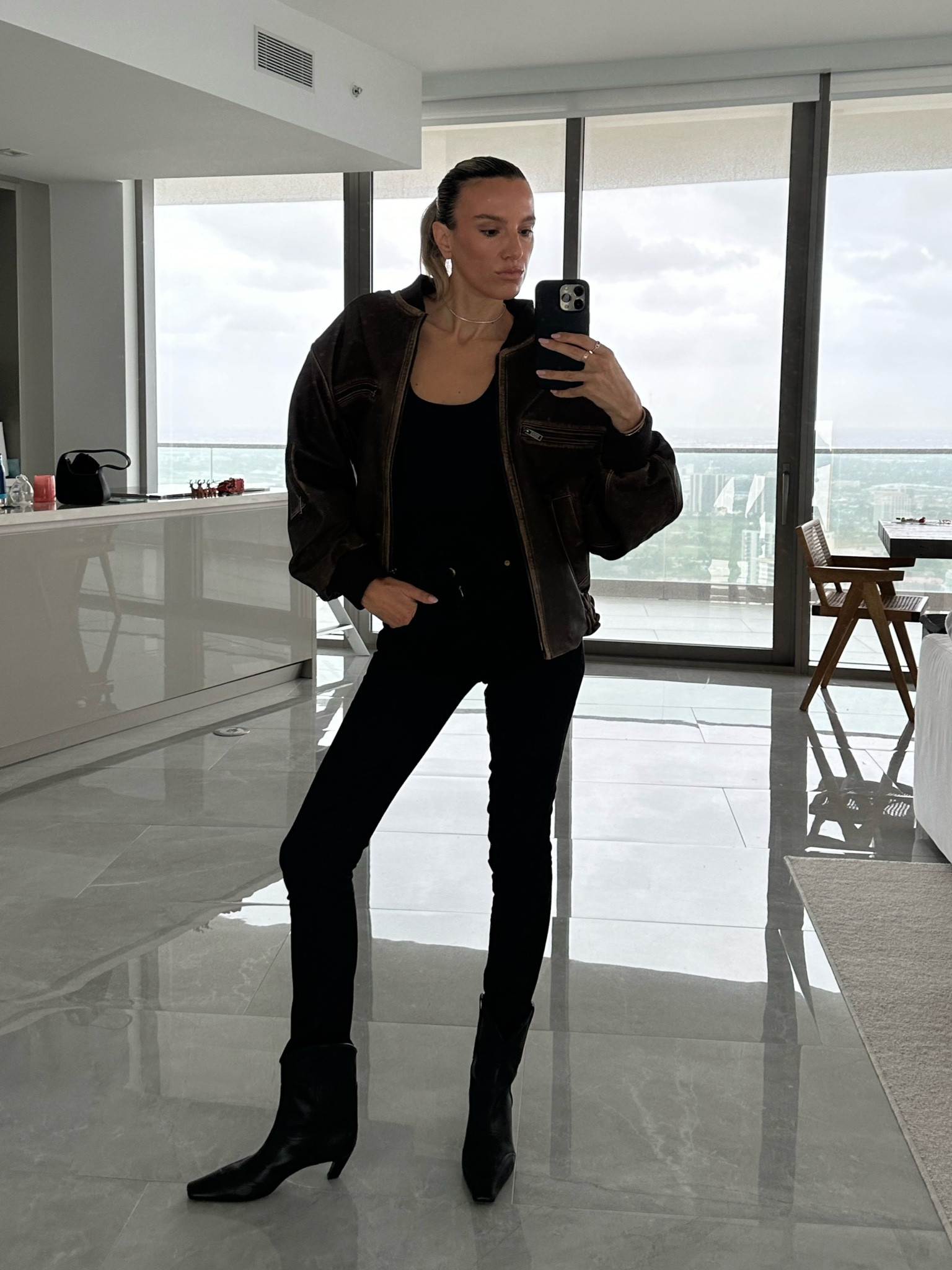 Casual all black look with a distressed bomber jacket. 

Outfit inspo, jeans, boots

#LTKfindsunder100 #LTKstyletip