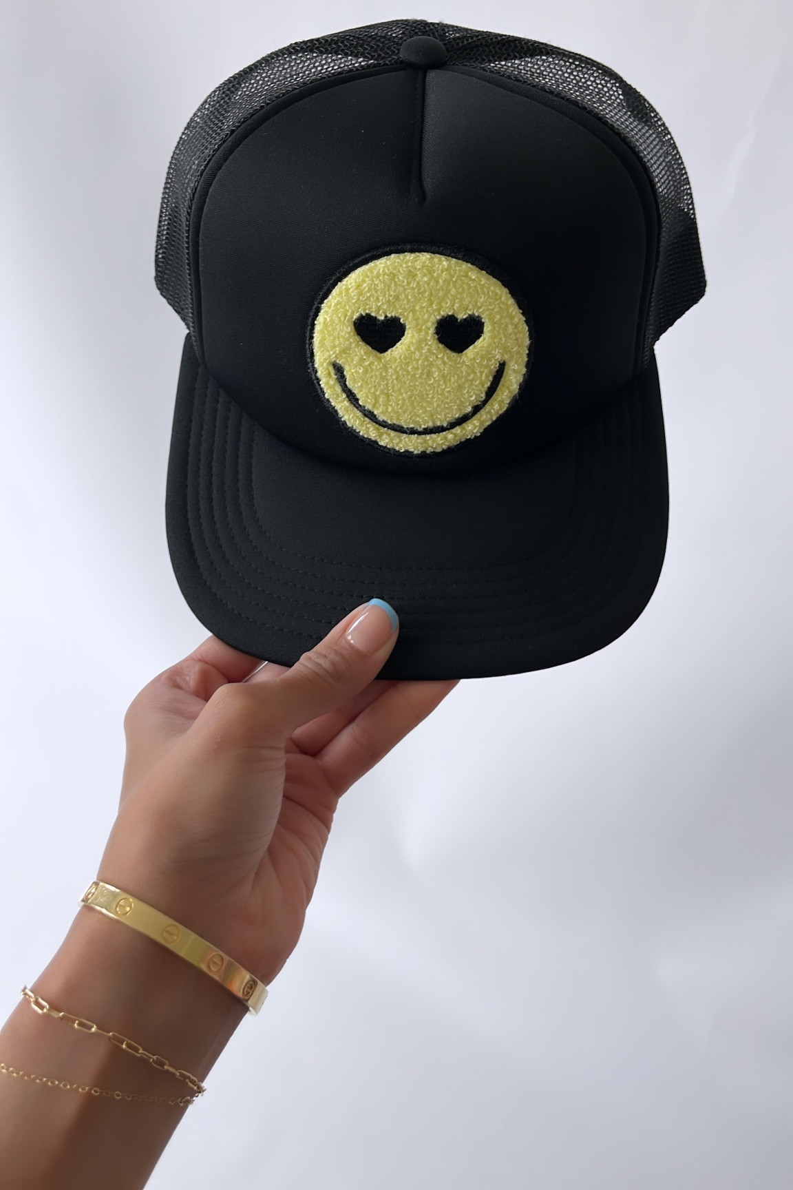 Smiley face hat 

#LTKsalealert #LTKFestival #LTKfindsunder50