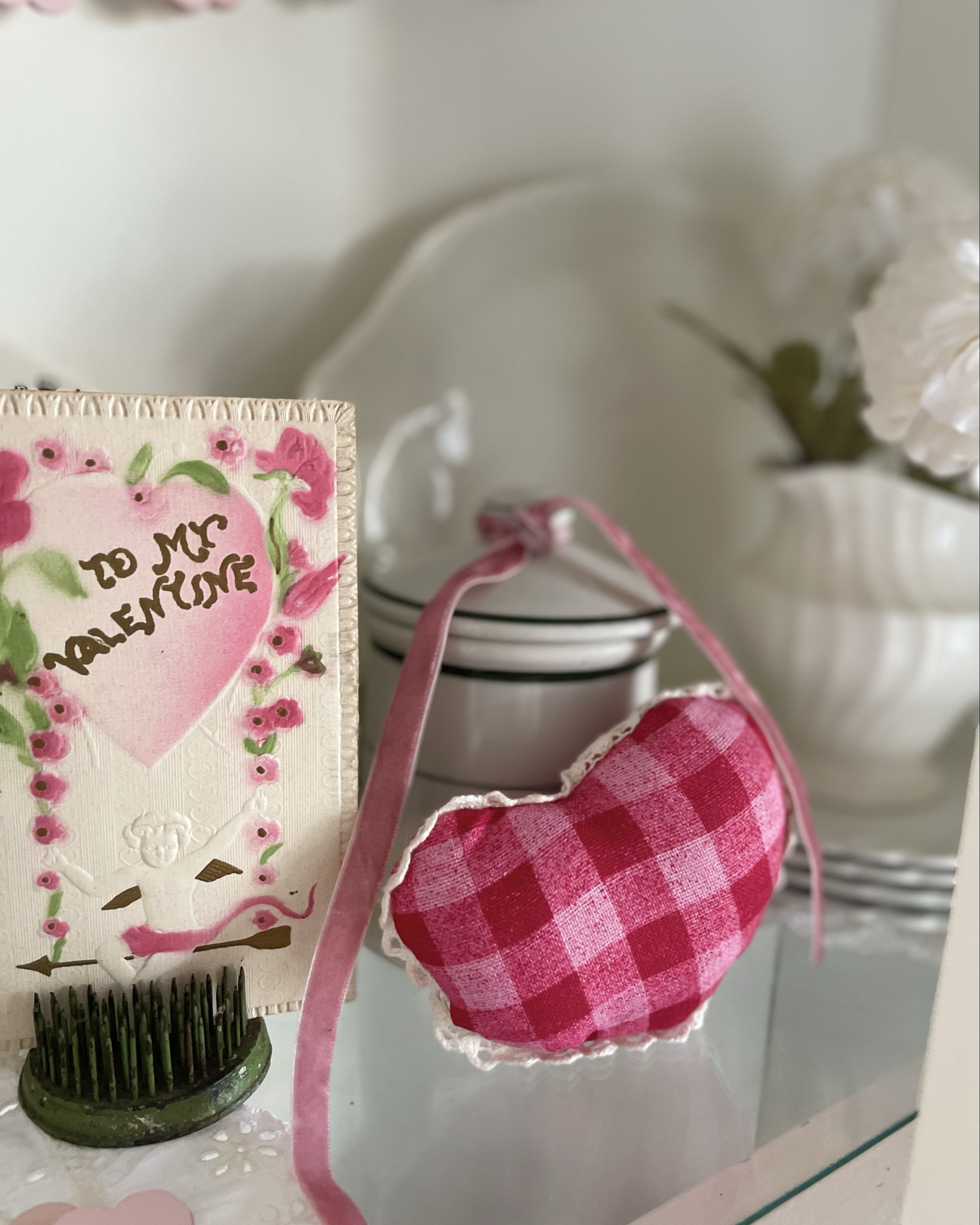 Vintage valentine decor never goes out of style! Combined with a few hearts and some pink ribbon, I was able to decorate my hutch for under $20! You can totally style your home for the seasons on a budget.

#LTKSeasonal #LTKHome