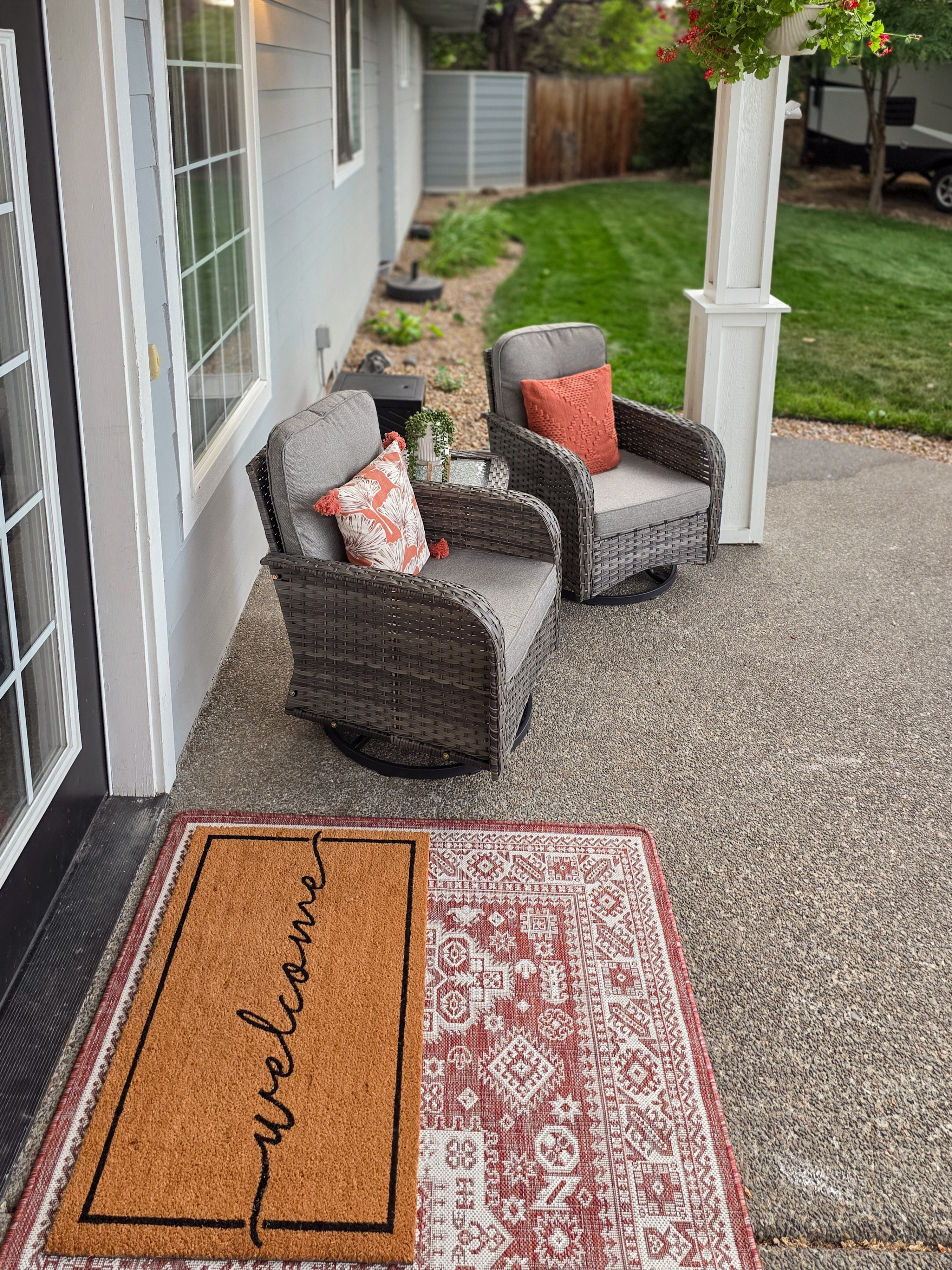 This front porch came together with a layered outdoor rug and doormat combo, gray swivel chairs, and a mix of pillows that make it feel like an extension of our living room. It's the kind of spot where we end up lingering way longer than planned, coffee in hand. #frontporch #outdoordecor 

 #LTKSeasonal #LTKHome