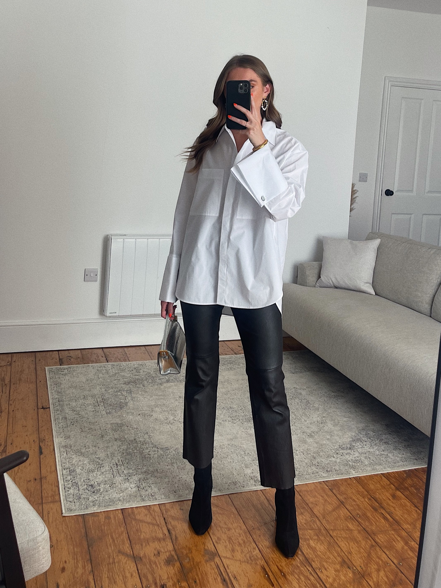 Small in the h&m oversized white shirt
Leather kickflare trousers
Amazon fashion ankle boots
Silver bag