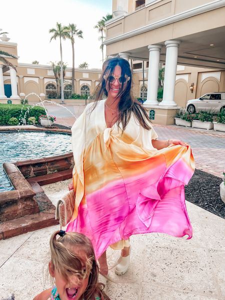 A Mumu moment for my vacation  queens. This pink and yellow caftan dress was so fun to wear on vacation. I’m definitely repeating the dress for date night. Satin,
Sleeves, and a bow tie in the front. Such a flowy dress you’ll love it!
.
.
.
.
.
.
#caftan #mumu #backtoschool #clogs #sunglasses #buddylove #amazonsunglasses #disney #vacation #weddingguestdress #clutch 

#LTKparties #LTKtravel #LTKBacktoSchool