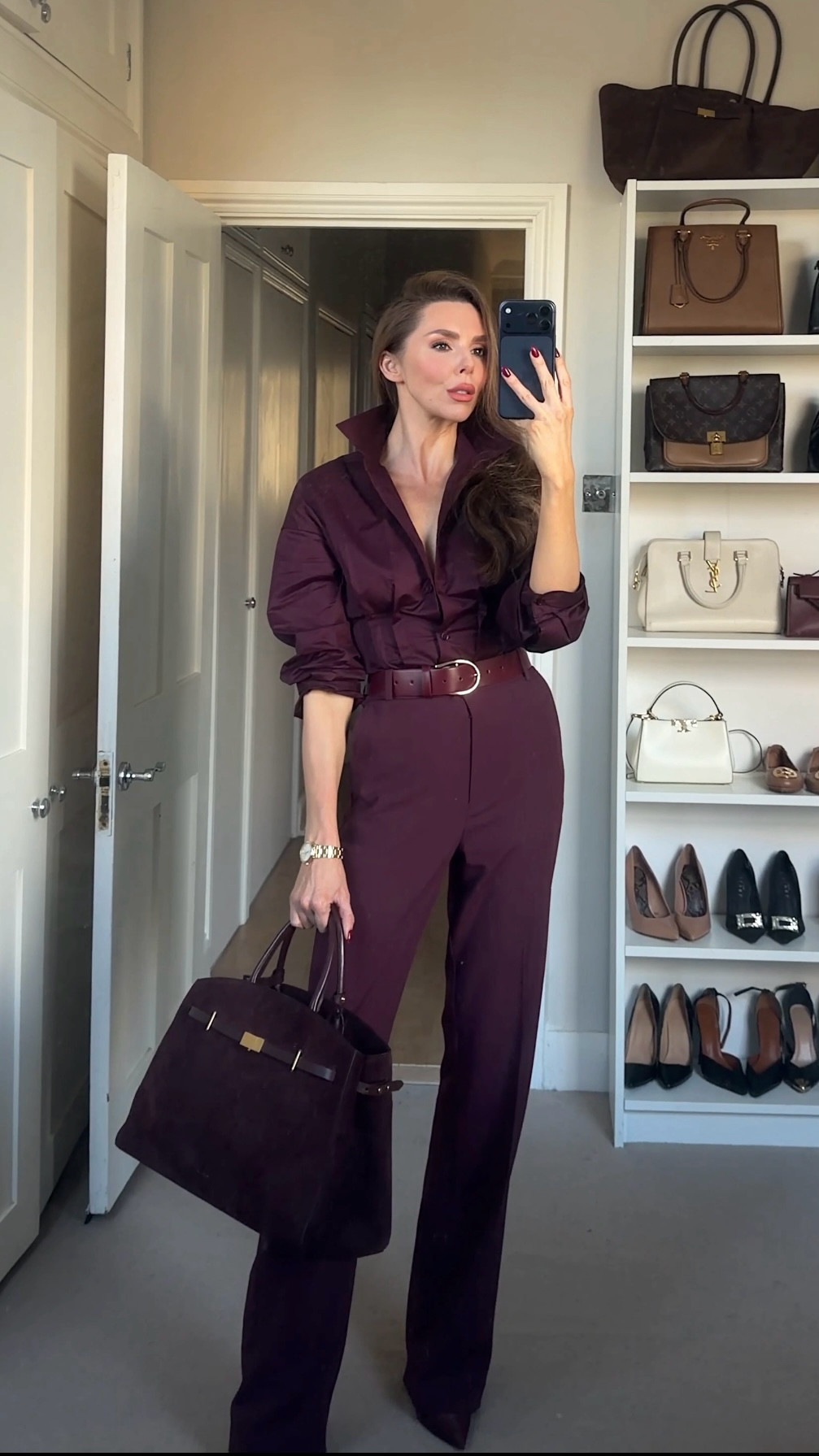 
Deep burgundy shirt styled with a matching burgundy belt and tailored trousers for a full monochrome look. Burgundy boots add the final touch of rich colour. Finished with the burgundy suede Demellier Hudson tote bag. A chic winter outfit idea and a polished workwear look that is timeless, elegant, and easy to recreate. Perfect if you are searching for a burgundy outfit, an all red outfit, or a monochrome styling idea.


#LTKworkwear #LTKuk #LTKCyberWeek