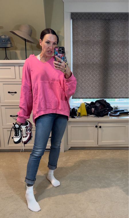 Bright pink for spring! Loving this oversized sweatshirt paired with jeans and sneakers. Wearing size small in sweatshirt. Size 25 in jeans. Size 7.5 in sneakers 

#LTKstyletip #LTKover40 #LTKSeasonal