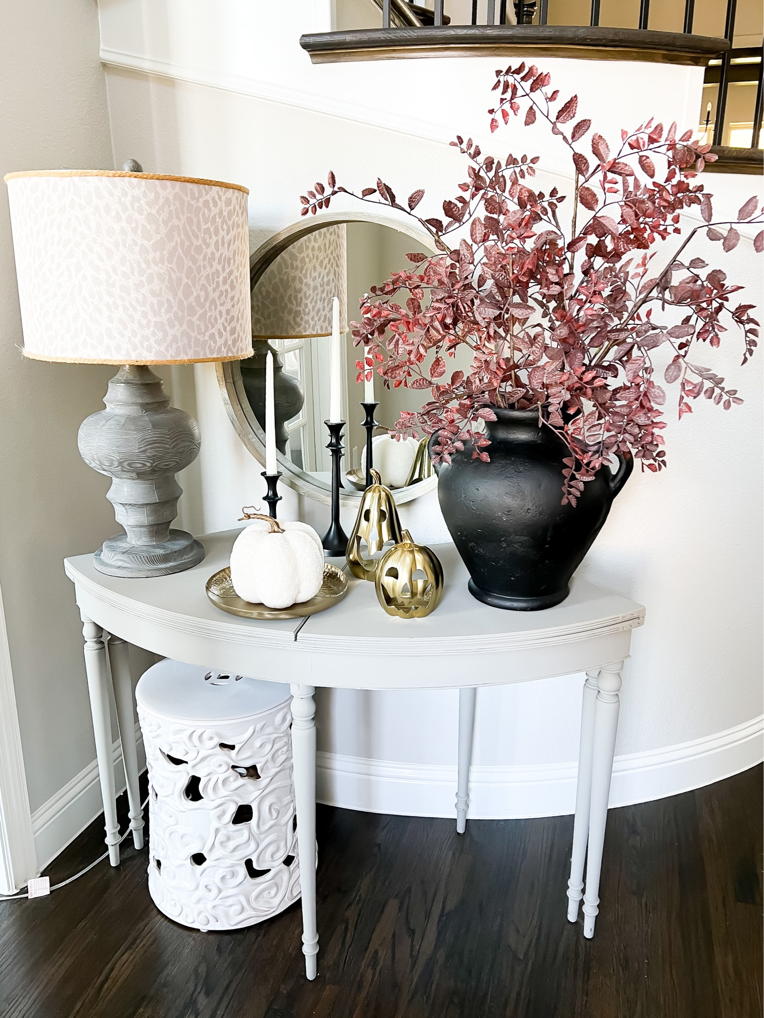 Hey y'all! Sharing a little bit more of my Fall/Halloween decor today. This is the table in our front entryway. I didn't do a lot, just added pumpkins and fall foliage to my vase but I really like how it turned out. I love adding spooky decor to my fall decor, it makes it easy because after Halloween I'II put away the gold pumpkins and be ready for Thanksgiving!

#chiconashoestringdecorating #fallentrytable #simplehalloweendecor

#LTKhome #LTKSeasonal #LTKHolidaySale