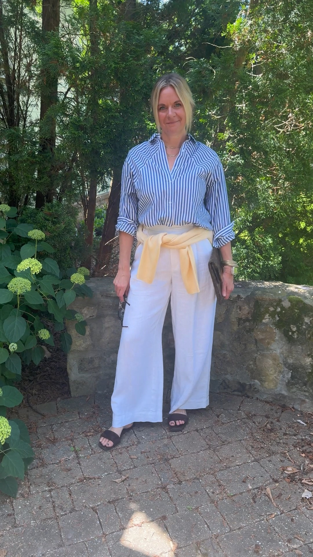 OOTD before heading out for a client personal shopping appointment ✨ Blue and white striped shirt + white wide leg linen pants + yellow cardigan tied at the waist + brown suede slide sandals + layered necklaces + blue lens sunglasses. All from my own closet — linked the closest versions I could find. Everything shoppable below! 👇

#LTKdayinmylife #LTKootd #LTKOver40