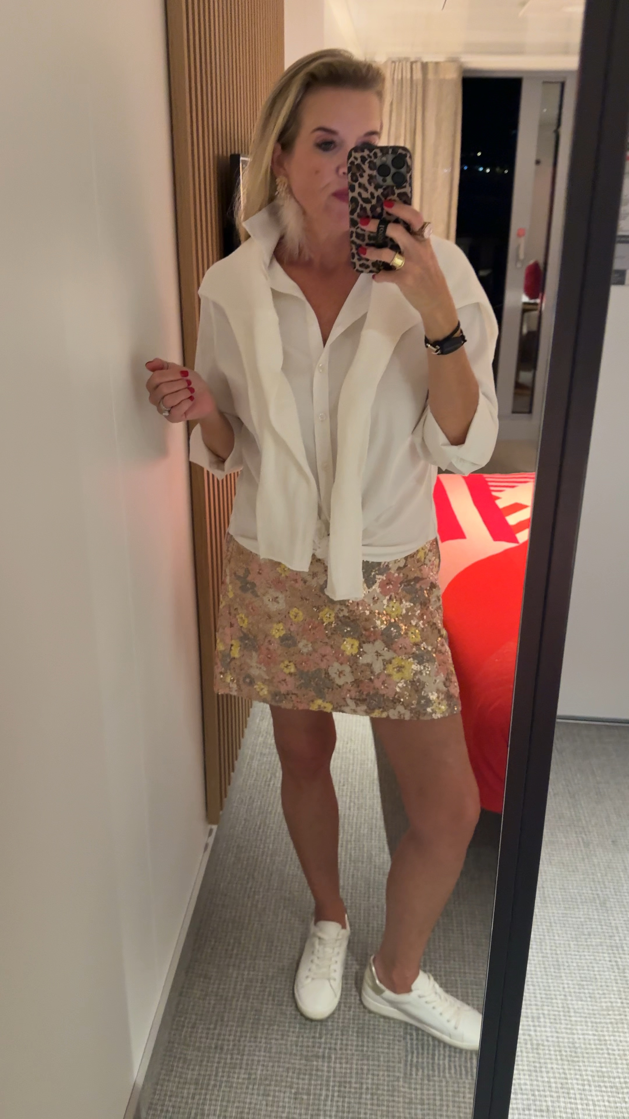 🚨sale
Holiday outfit idea / none traditional and perfect for warmer weather!

Great for travel as well!!

I wore this to dinner on the cruise! 

🚨 40%off  now $47 Loft floral sequins skirt in blush, yellow, rose gold and pewter 
Fits tts in a 4

Chicos white button up shirt- no iron best button up’s 

White sweater over shoulders 
Pink pineapple Hermes graphic sweater tts

Chicos pink feather statement earrings perfect for holidays outfit 

White leather Chico sneakers 
With pewter back detail 

Pink cocktail ring 

#LTKSaleAlert #LTKStyleTip #LTKHoliday