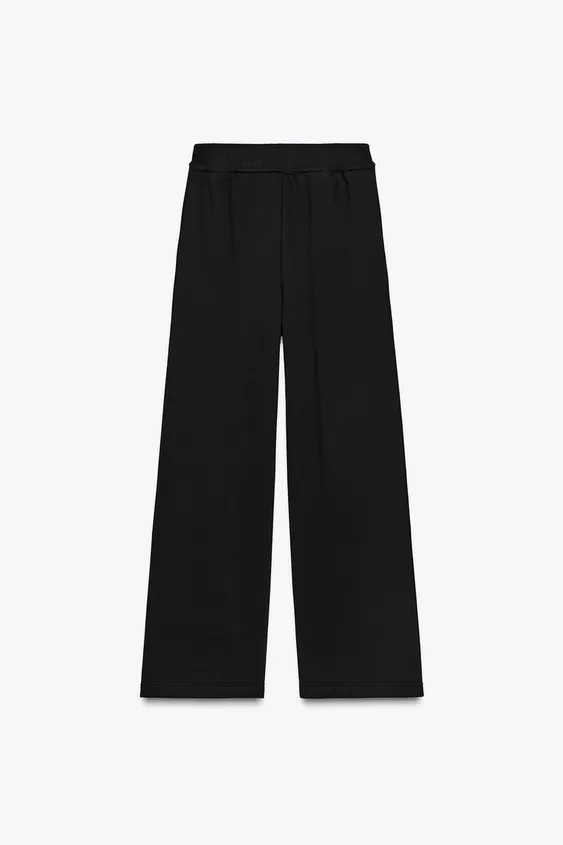 Mid-rise pants with adjustable elastic drawstring waistband. Inseam concealed side pockets. Wide leg. | Zara US