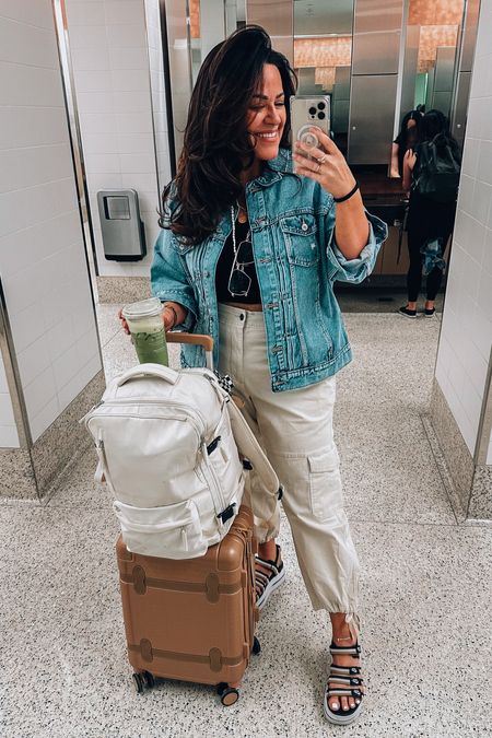 Midsize Travel outfit - airport outfit 
Cropped cargo pant wearing an xl- wlastoc waist and loose comfy fit! 
Cropped tank large 
Denim boyfriend jacket xl 
Platform comfy Nike sandals tts 
Luggage, carry on travel bag 
Strapless bra tts 38dd 


#LTKcurves #LTKtravel #LTKSeasonal