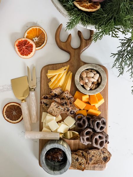 Holiday entertaining and/or easy hostess gift idea: festive serving board and a set of pretty cheese knives. 

#LTKhome #LTKunder50 #LTKHoliday