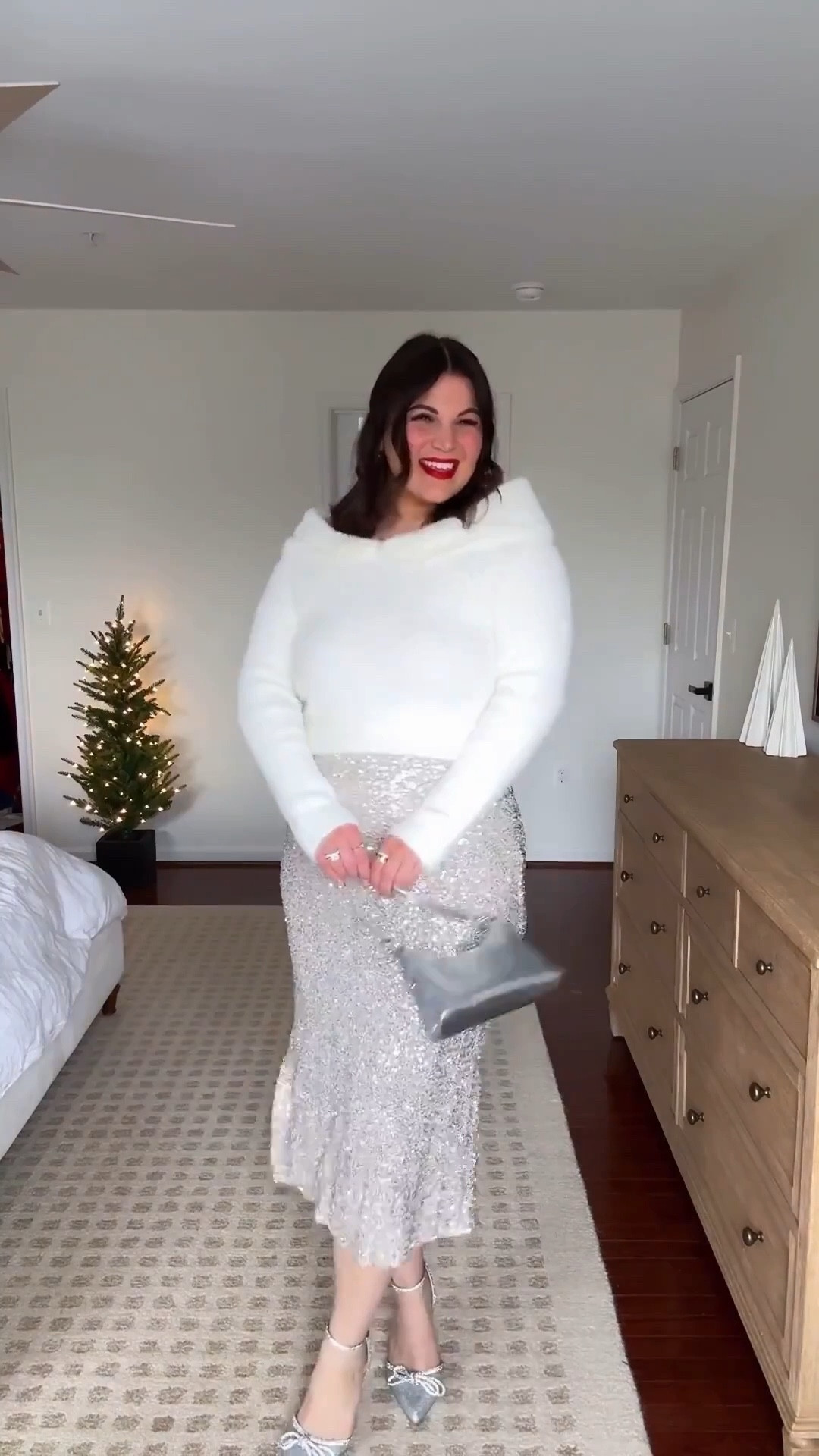 Midsize holiday outfit! You went crazy for this sequin skirt in black so naturally I had to grab the silver as well! And it’s just as good!! 😍 styled it with this white fluffy sweater + some silver accesssories to go with the skirt! You can shop both at @shopbalticborn + use my code KELLY15 to save! 

Strapless -  xl *use code KELLYTK20 to save 
Sweater - xl
Skirt - xl
Heels - 9 
*similar bag



#LTKootd #LTKMidsize #LTKHoliday