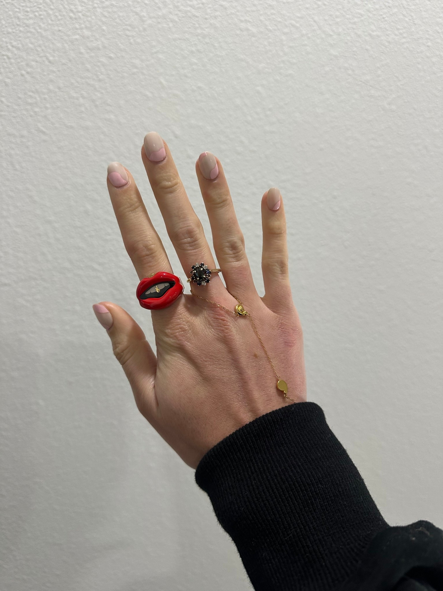 A glossy black dial with white "teeth" detailing creates a striking contrast against the rich red–coated, lip-shaped stainless steel case, adding visual depth to this playful yet refined timepiece. The gold-tone stainless steel bracelet features an expansion band design for an easy, comfortable fit. Clean two-hand movement keeps the dial minimal and streamlined, highlighting the modern, fashion-forward aesthetic of this piece. @fossil 

#LTKSeasonal #LTKootd #LTKValentine