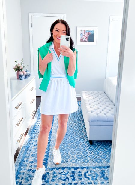Obsessed with this new tennis dress from Addison Bay! Polo style activewear dress for women with blue details, fits TTS, I’m wearing a small. Layered under a green pullover sweatshirt for cooler weather and paired with my favorite white sneakers, which are on sale!!

Preppy style, women’s activewear, new arrivals, resort 2023, golf clothing, tennis style, mom style, school pickup outfit, spring fashion #activewear #tennisdress #activeweardress #newarrivals #resort 

#LTKSeasonal #LTKfit #LTKsalealert