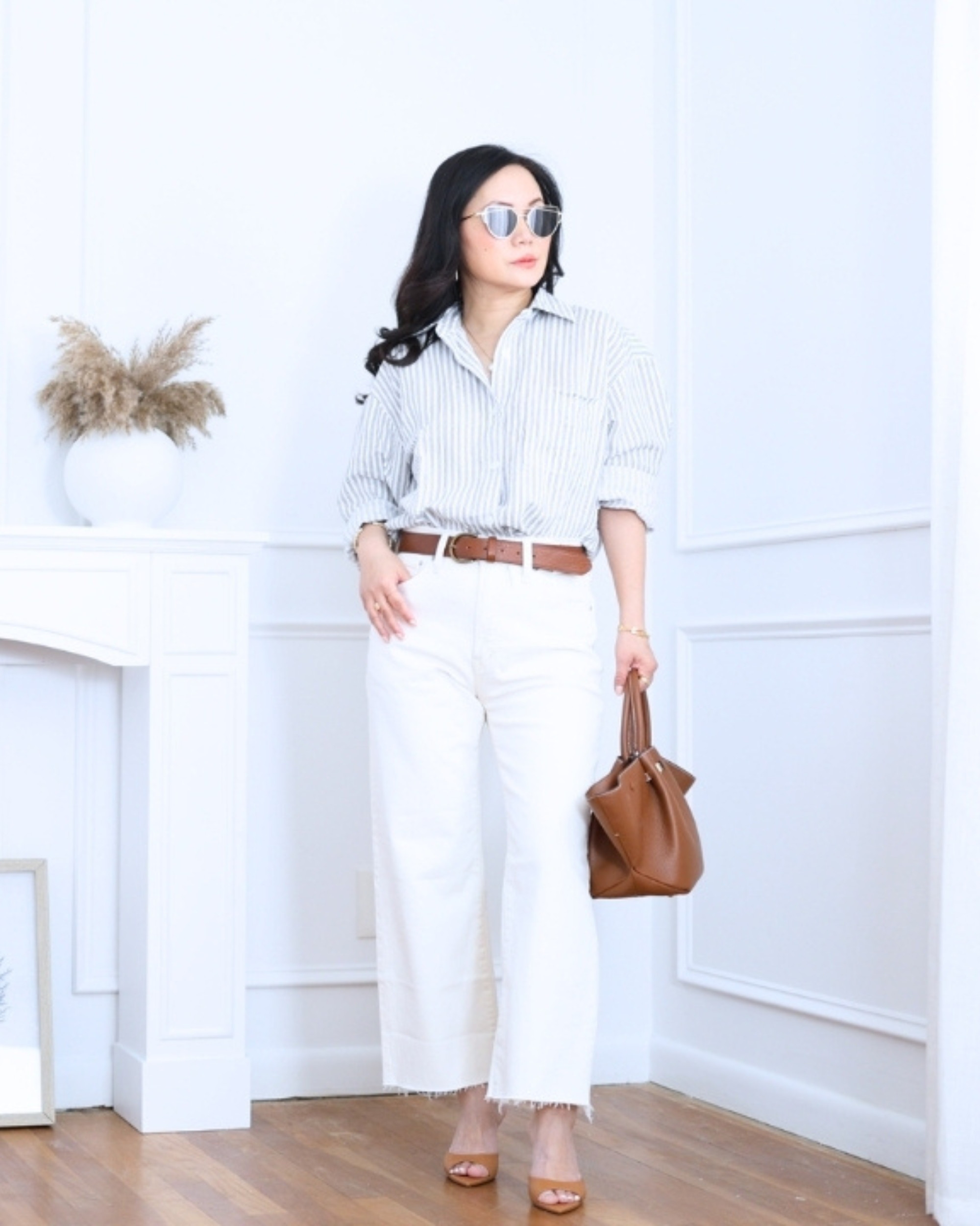 Pinstripe shirt paired with white jeans from Madewell — classic, crisp, and effortlessly polished. An easy outfit that feels timeless, relaxed, and put together without trying too hard. I'm 5'2, wearing size S. 

 #LTKootd #LTKOver40 #LTKPetite
