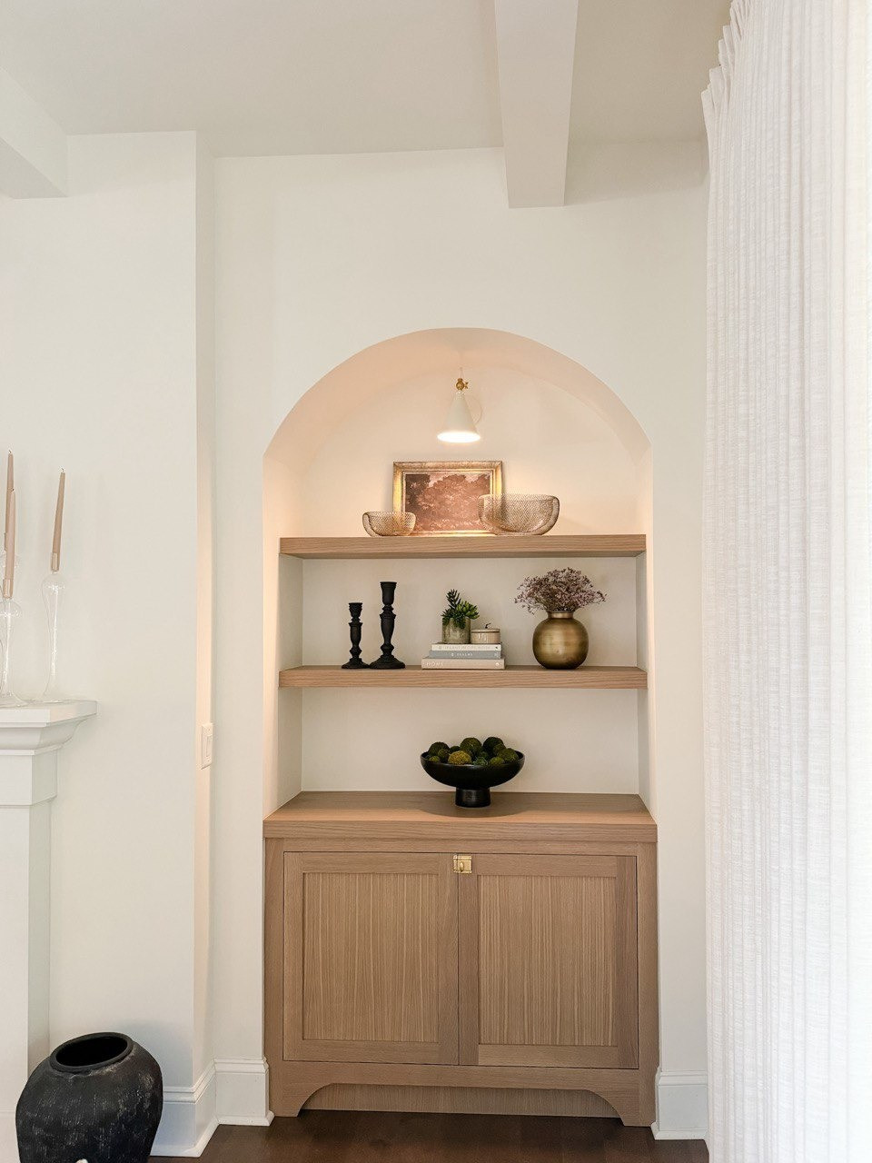 Living Room. Upholstered Sofa, Moss Bolls, Liz Linan Drape Pleated, Ceiling Light, Brass Wire Decorative Bowl, 1 Light Wall Sconce, Cogan Armed Sconce, Area Rug, Moody Trees Framed Wall Canvas Board. 

#LTKHome