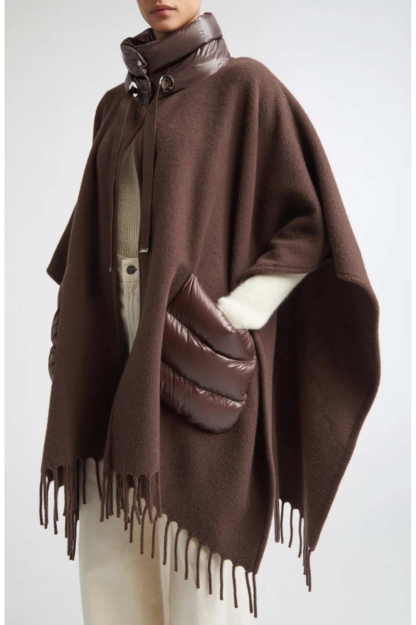 Mixed Media Fringe Trim Poncho
Herno

Down-insulated channel quilting at the neckline and pockets pays homage to the label's renowned puffer jackets in this fringe-trimmed poncho crafted from a rich blend of wool and cashmere.

#LTKootd #LTKWorkwear #LTKTravel