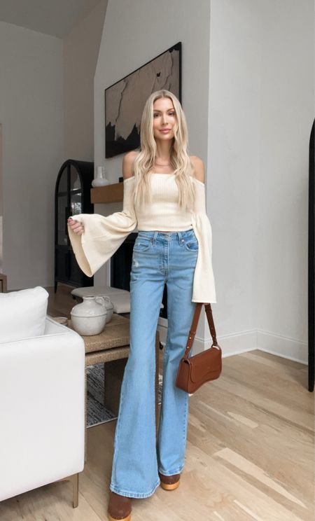 Revolve off the shoulder sweater neutral spring flare jeans long spring outfit 