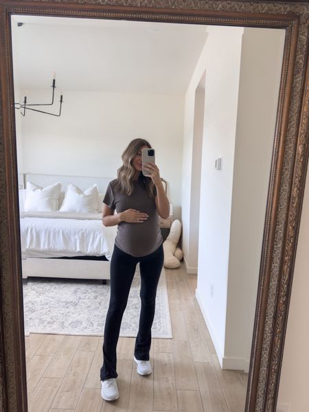 These flare leggings are always a bestseller - they fit tts unless pregnant id suggest going up a size! This top is sold out but linked some other ones from NUUDS or else the hold tight short sleeve is almost identical (I have that also) 🤍  size up in that also if pregnant! 

#LTKBump #LTKFitness