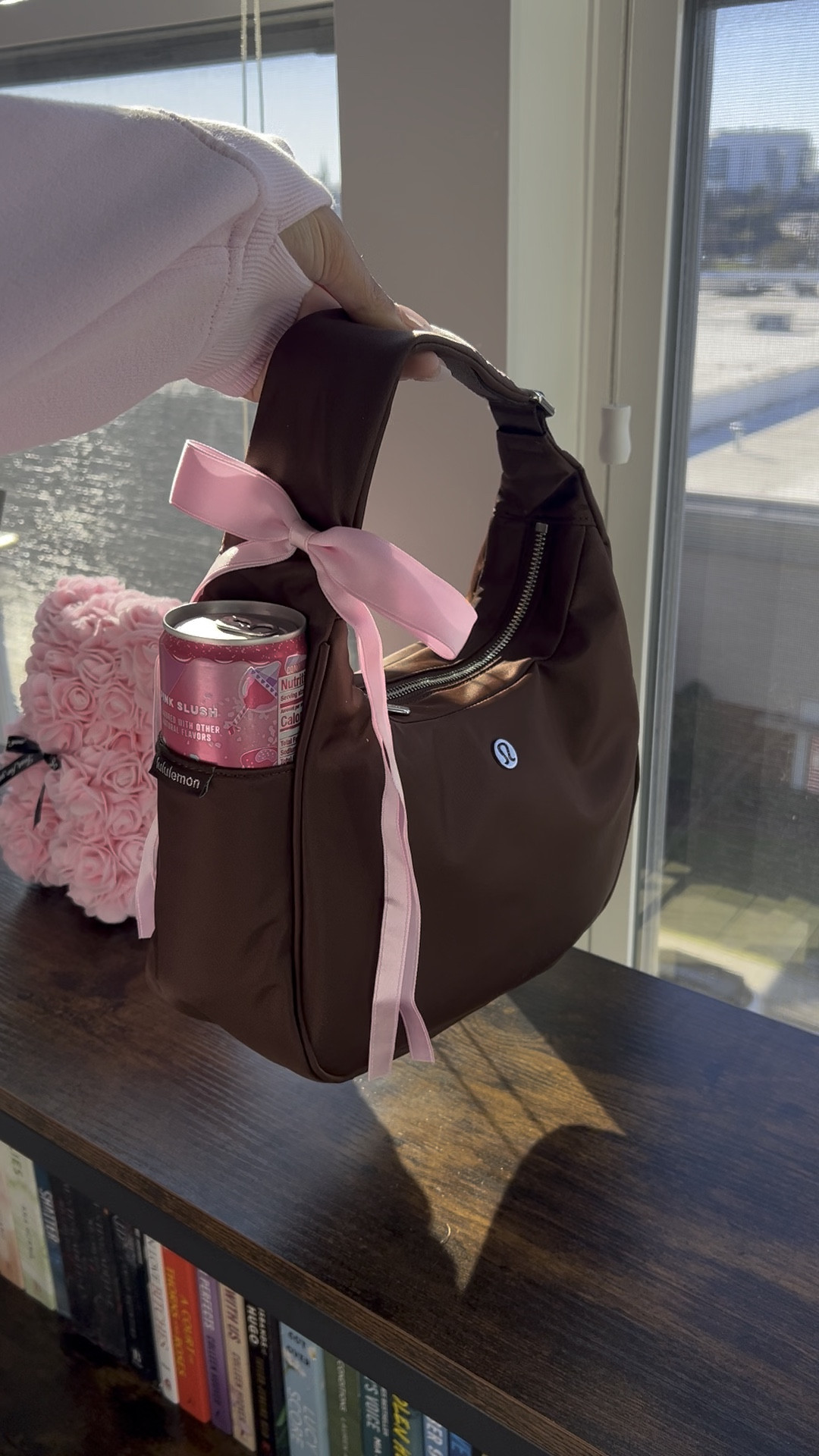 Lululemon Espresso Shoulder Bag with a pink bow I added from Amazon. 🧸🎀☁️

#LTKGiftGuide #LTKBeauty #LTKMostLoved