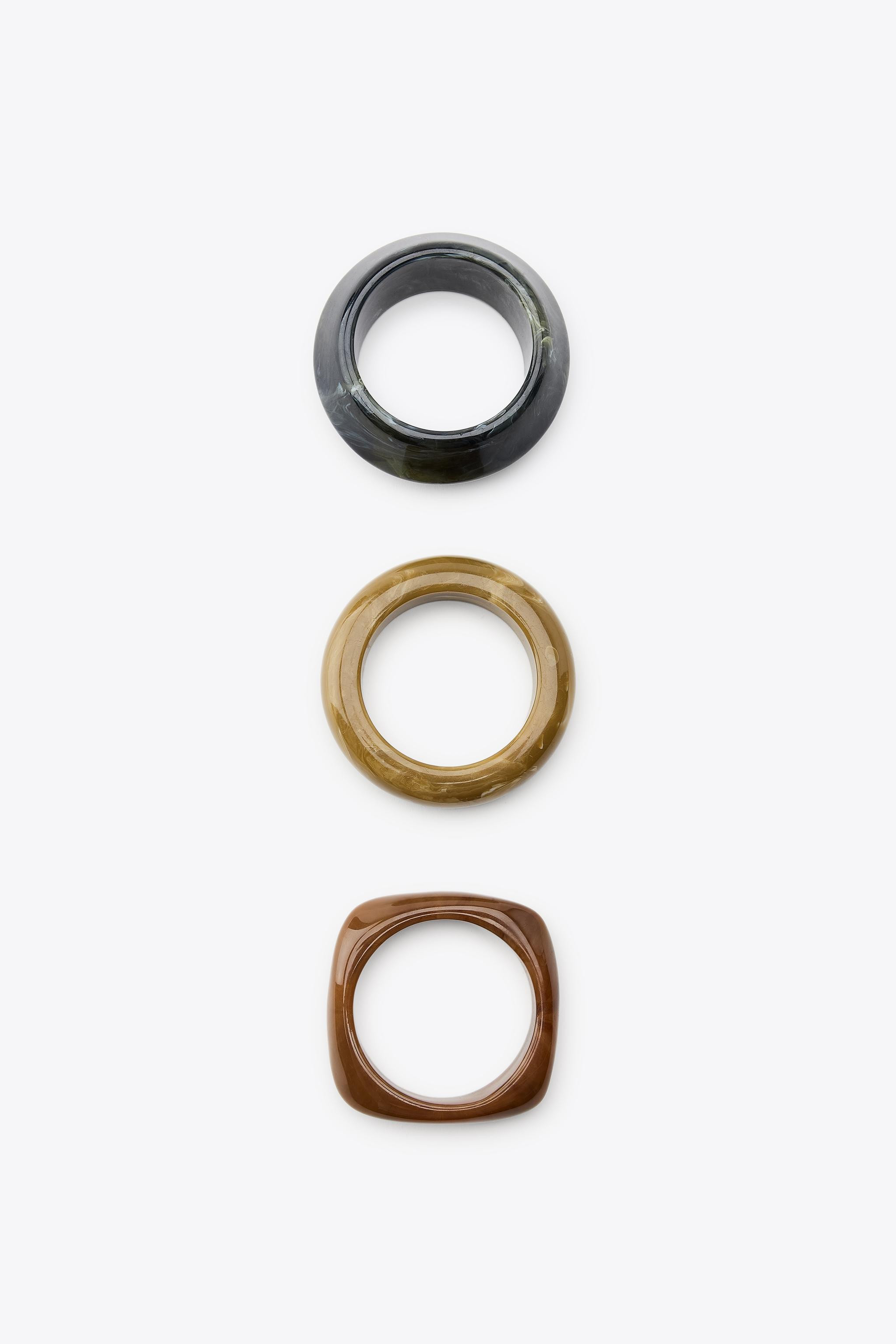 Pack of three rigid resin bracelets in different shapes and sizes. | Zara US