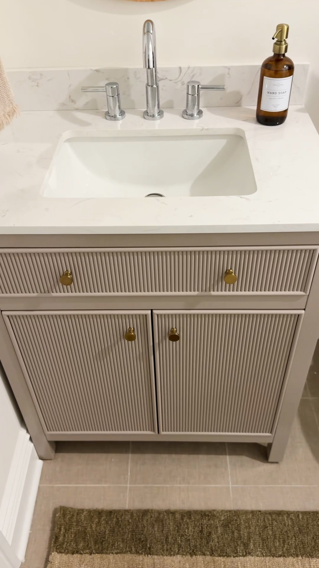 This vanity from Wayfair is so gorgeous and truly affordable! Love the fluted detail and the brass hardware. It also comes with thisaevle countertop!! Linking the faucet, mirror and accessories that I used for this bathroom refresh 🙌🏻

#LTKHome #LTKSaleAlert #LTKSeasonal