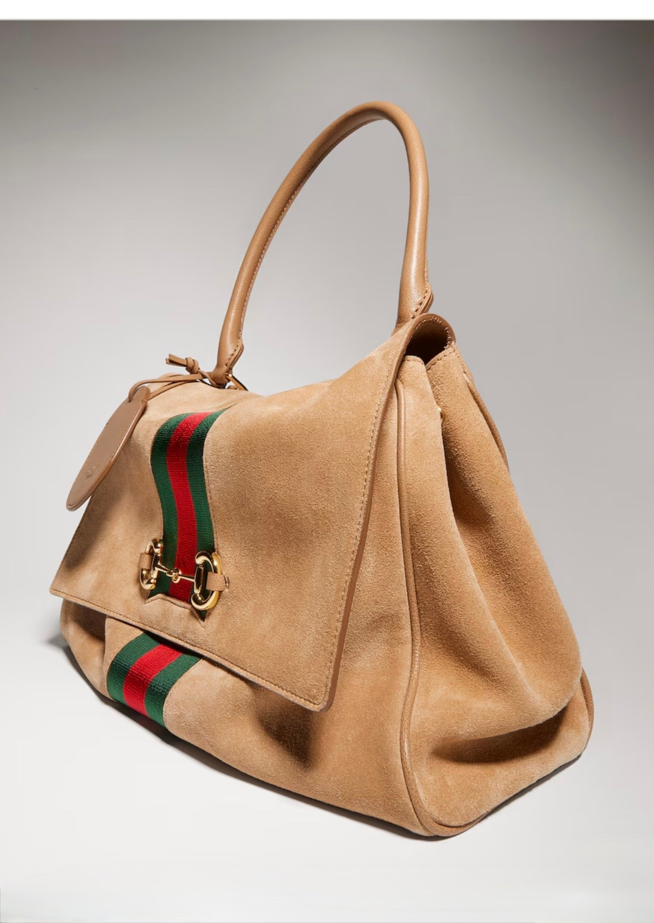 Gucci Paparazzo medium top handle bag

Generation Gucci delves into the brand's archival and visual codes, and combines different generations of design into one aesthetic narrative. This style pays tribute to the House's emblematic Horsebit with a top handle design, and is crafted from soft suede in a sophisticated coloration.

#LTKWorkwear #LTKootd #LTKTravel
