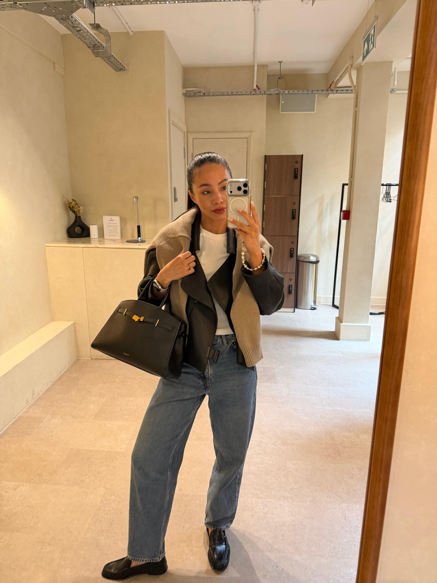 Spring OOTD 🤍 the weather doesn’t know what it’s doing so it’s all about chic layering, leather jacket and a knit over the shoulders with barrel jeans

#LTKspring #LTKjeans #LTKstyletip