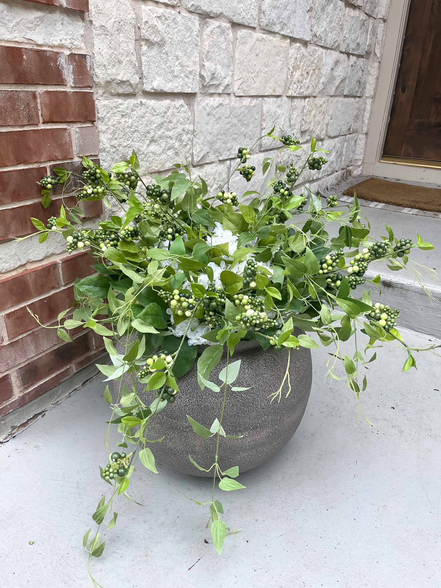 Faux hydrangea arrangement in my Studio McGee planter for my front porch decor  

#LTKSeasonal #LTKstyletip #LTKhome