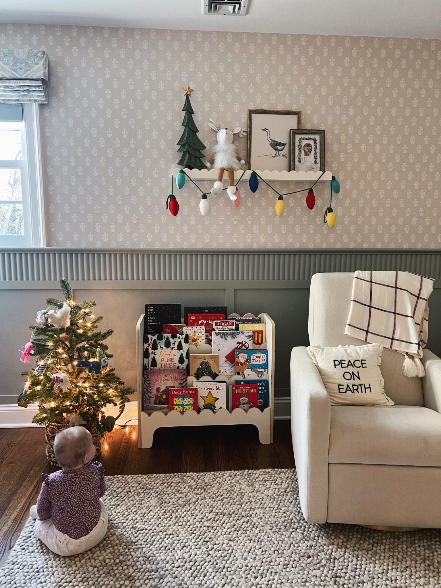 Dylan’s nursery holiday decor 
-worked with a designer, so not sure of wallpaper source and paint color 
-shelf decor was all homegoods finds, but found the goose print on Etsy 
-Christmas tree basket was a homegoods find 
-most of the ornaments are ones we’ve collected from West Elm, all felt 
-rug is 8x10 in beige 

#LTKHoliday #LTKHome #LTKKids
