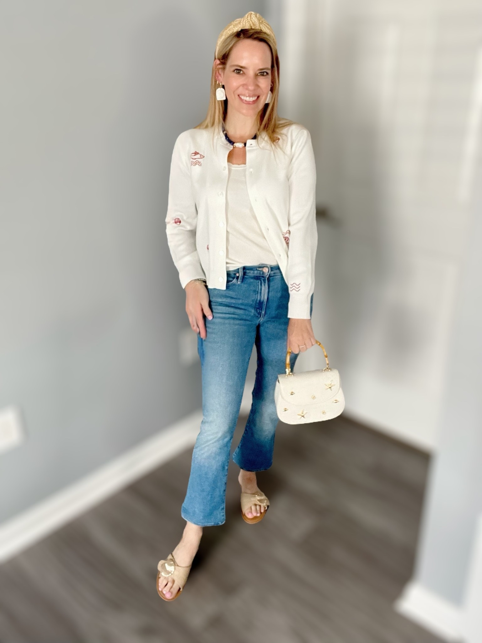 🐚 Coastal casual with a twist! I’m wearing this adorable white embroidered cardigan featuring subtle coastal motifs like seashells and fish 🐟 over a soft ribbed tank. Paired it with cropped flare jeans for a comfy daytime look and accessorized with coastal textures from head to toe.

✨ Wearing size XS in the cardigan and size 25 petite in jeans. My earrings are handmade by @mellstrinkets on Instagram 🤍 and I added my favorite Melinda Maria jewelry — use code PREPPYREBEL for 10% off!

👚 Cardigan: Size XS – embroidered with fish and shell details
👖 Jeans: Size 25p – soft stretch, slight flare crop
👜 Bag: Cream mini satchel with bamboo handle + gold sea charms
👡 Sandals: Gold Palm Beach Sandals
🎀 Accessories: Raffia headband, Mell’s Trinkets earrings, pearl + lapis necklace
💍 Melinda Maria rings and bracelets – use code PREPPYREBEL

#coastalstyle 🐚 #preppystyle 💫 #mellstrinkets 🤍 #ltkfinds 🛍️ #casualchic 👖 #melindamariajewelry ✨ #coastalgranddaughter 🎀 #classicwithatwist 💕 #flairdenim 👖 #embroiderydetails 🧵


#LTKItBag #LTKFindsUnder50 #LTKFindsUnder100