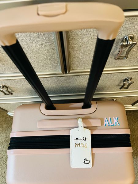 Millennial pink hard shell suitcase with the cutest engaged luggage tag and block monogram sticker!! 

#LTKtravel