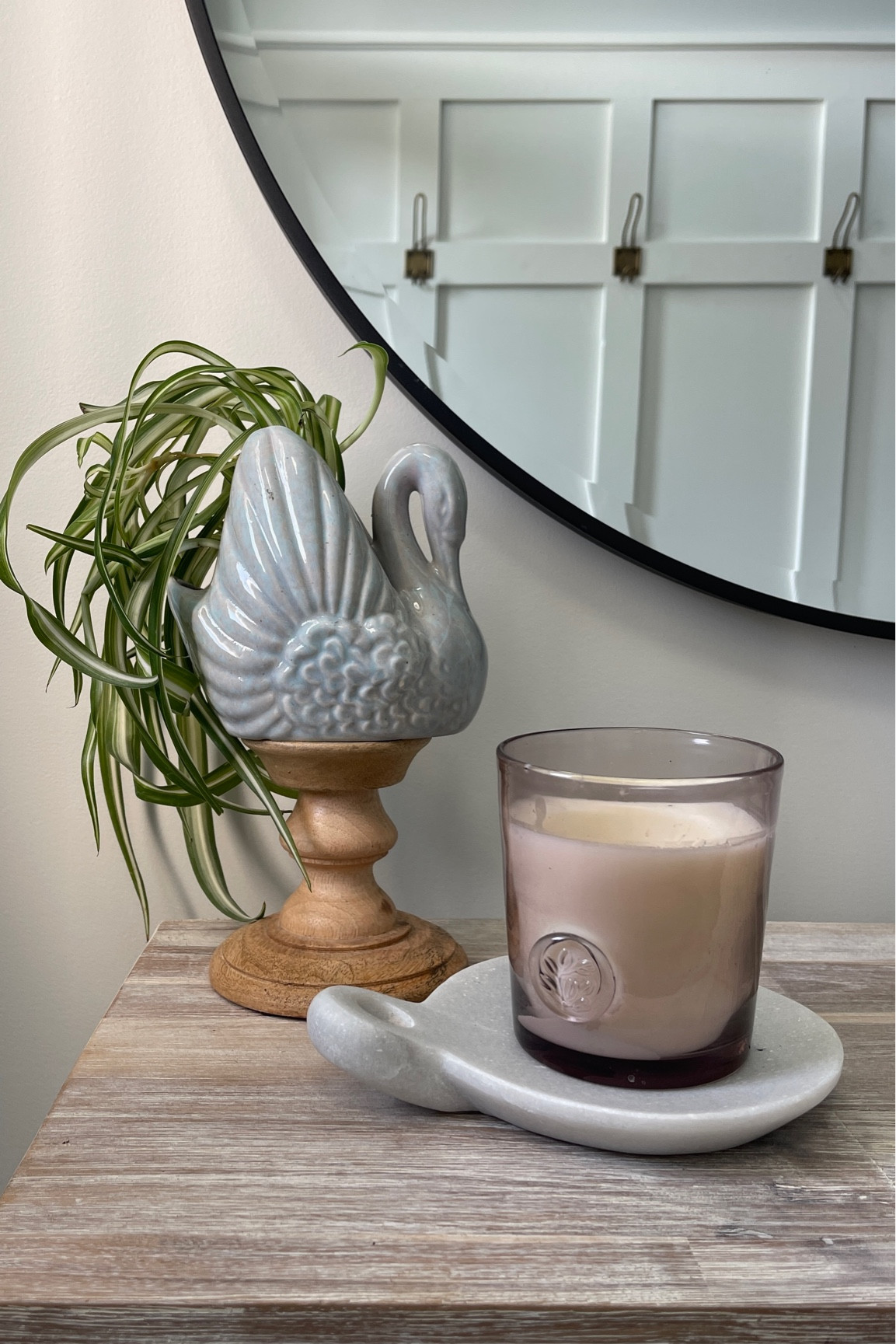 Entryway decor inspiration 
Candle, planter, round black mirror, marble dish, bronze coat hooks 

#LTKhome #LTKFind