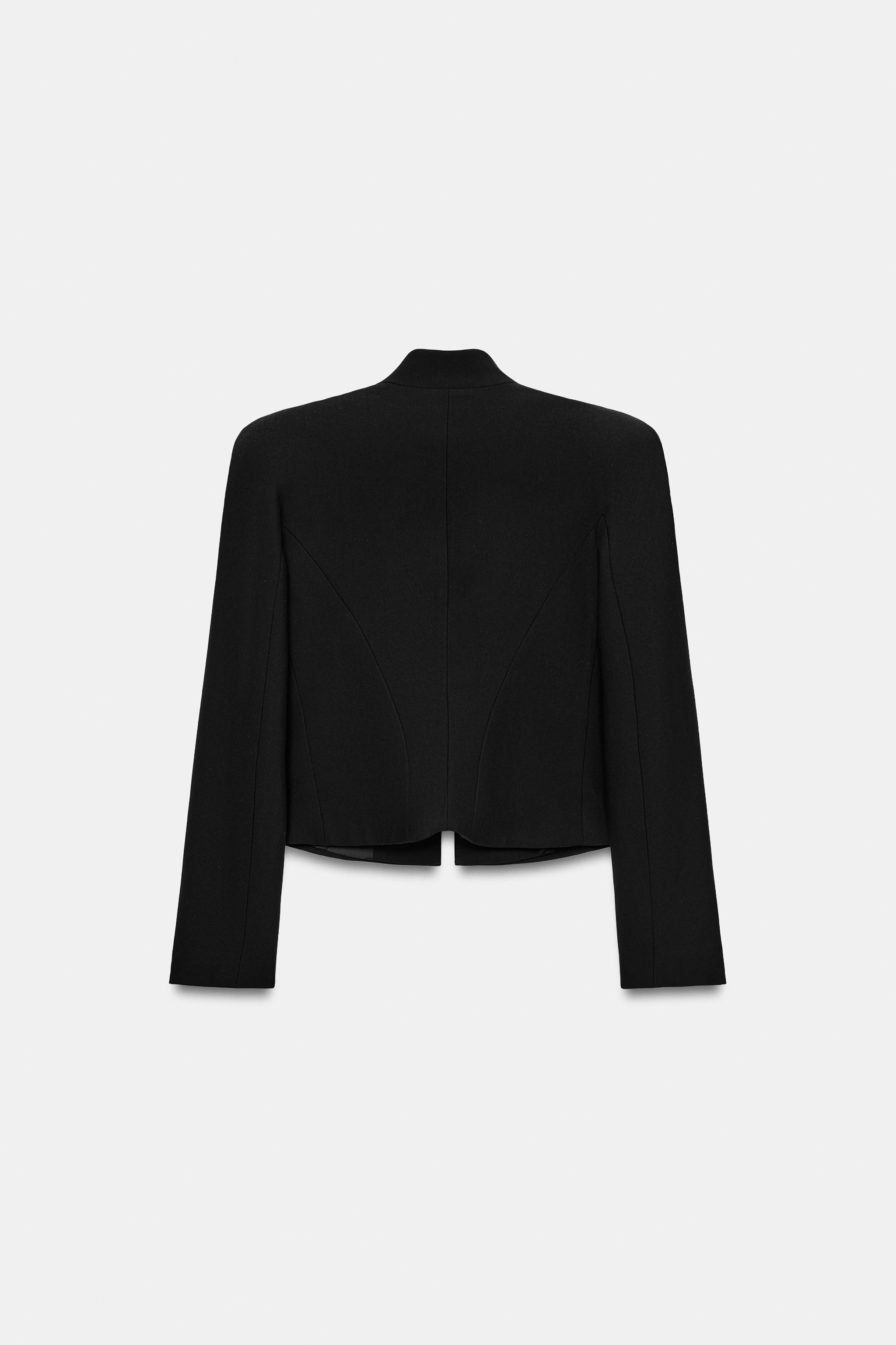 Round neck blazer with long sleeves and shoulder pads. Featuring tone-on-tone button and embroide... | Zara US