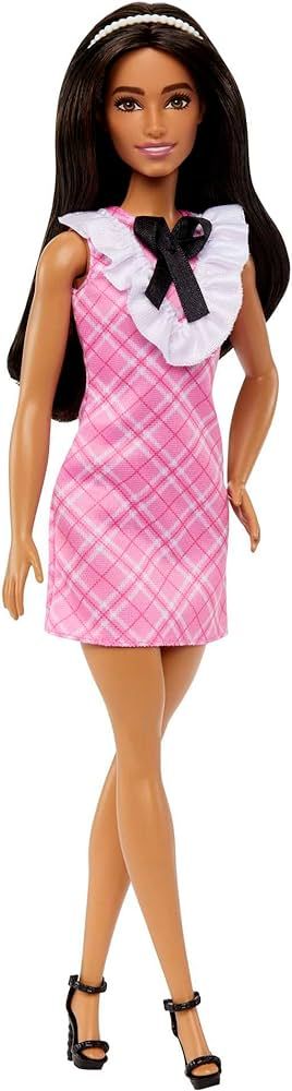 Barbie Fashionistas Doll #209 with Black Hair Wearing a Pink Plaid Dress, Pearlescent Headband an... | Amazon (US)