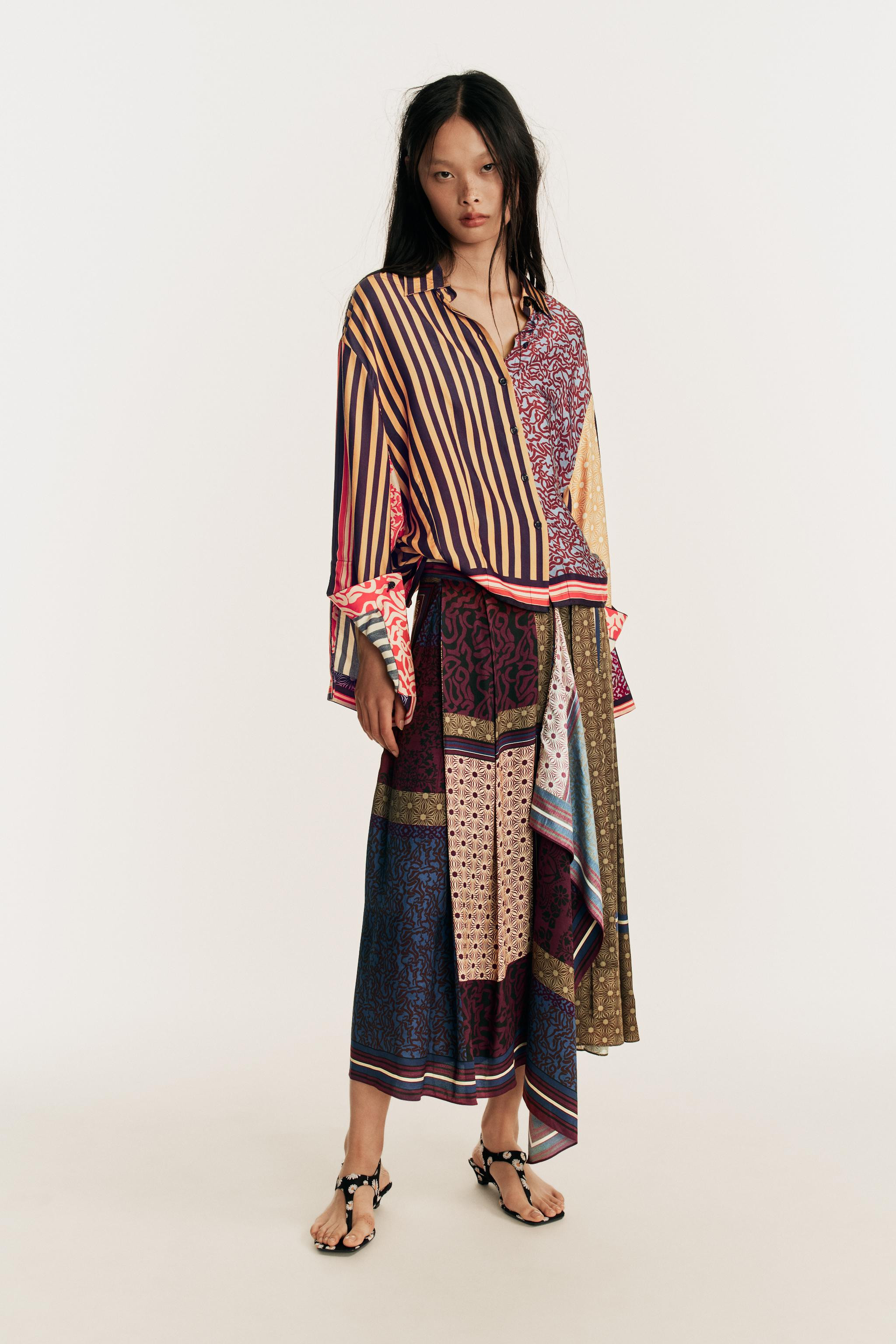 Shirt featuring a main fabric made of 100% viscose. Regular collar and long sleeves with a split ... | Zara IT