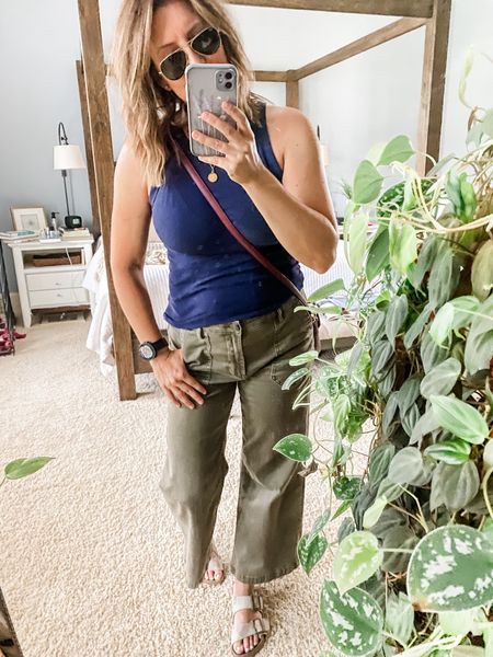 At heart, I’m a basics kind of gal. When it comes to my clothes, I don’t like bells and whistles and I don’t love following trends. I much prefer classic styles that fit well and fit my lifestyle (casual and relaxed).
So for me, that means summer weight trousers in go-with-everything olive, the BEST Target tank I have in about 10 colors, a classic crossbody, Birkenstocks, and my trusty aviators.
I might never win a best dressed award, but I will for sure always feel just like ME when I’m out and about and that means more than anything.


#LTKOver40 #LTKFindsUnder100 #LTKSeasonal
