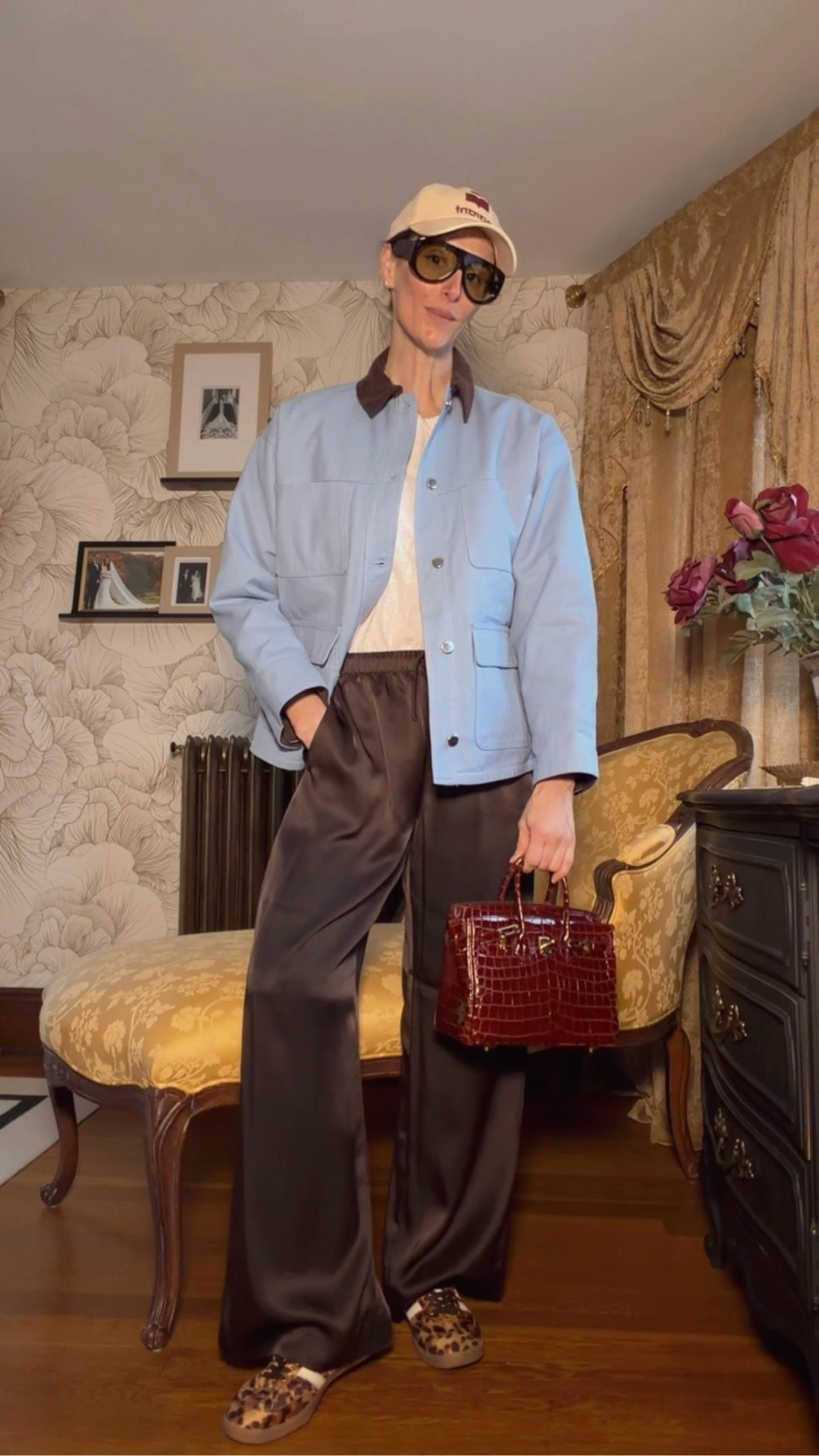 Starting with a simple base—just a classic white long sleeve and these chocolate brown trousers.

Now I’m layering on this blue jacket with the contrast collar… this is what really makes the outfit feel styled.

For shoes, I’m going with these leopard sneakers—adds just the right amount of texture and keeps it casual.

Let’s bring in some accessories—oversized sunnies for a little edge, and this burgundy bag to tie back to the tones in the look.

And to finish it off, I’m adding a cap for that effortless, off-duty vibe.

This is one of those outfits that feels easy, but still completely put together.

Save this for an elevated everyday outfit formula 🤎

#LTKStyle #LTKVideo #EverydayOutfit #CasualChic #RealTimeStyling #OutfitFormula #EffortlessStyle

#LTKgrwm #LTKootd