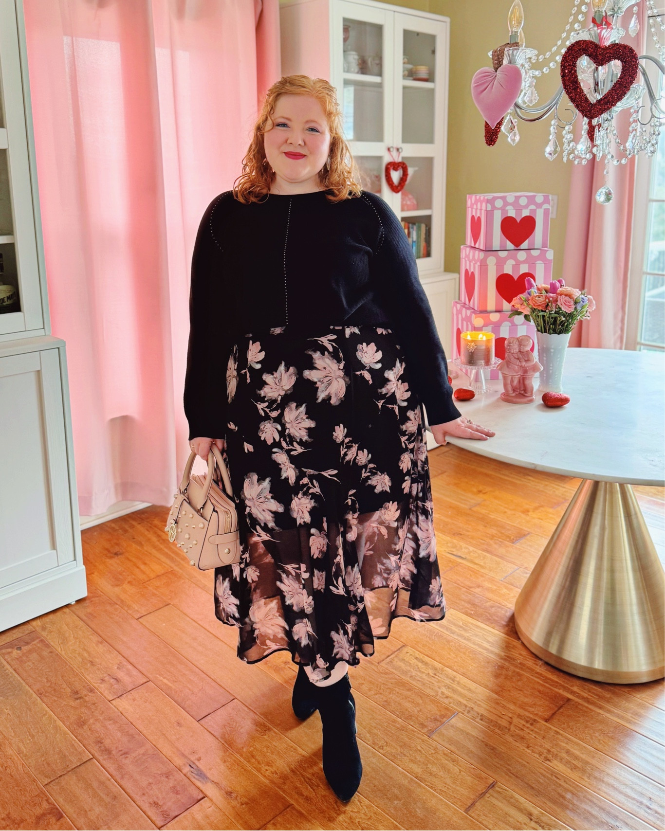 Valentine Outfit Idea | This Ulla Popken is on sale for just $44 with my code 2024LIZ25. Super on-trend for spring which means you can pick it up for VDay and wear it all next season too. Plus, you can use my code for 25% off your entire purchase at Ulla Popken.

Sweater 16/18 + skirt 20/22 @ullapopkenusa 
Heart earrings @kendrascott (old)
Pink Henri Bendel Bag (old)
Black waterproof booties @nordstrom 



#LTKfindsunder100 #LTKSeasonal #LTKplussize