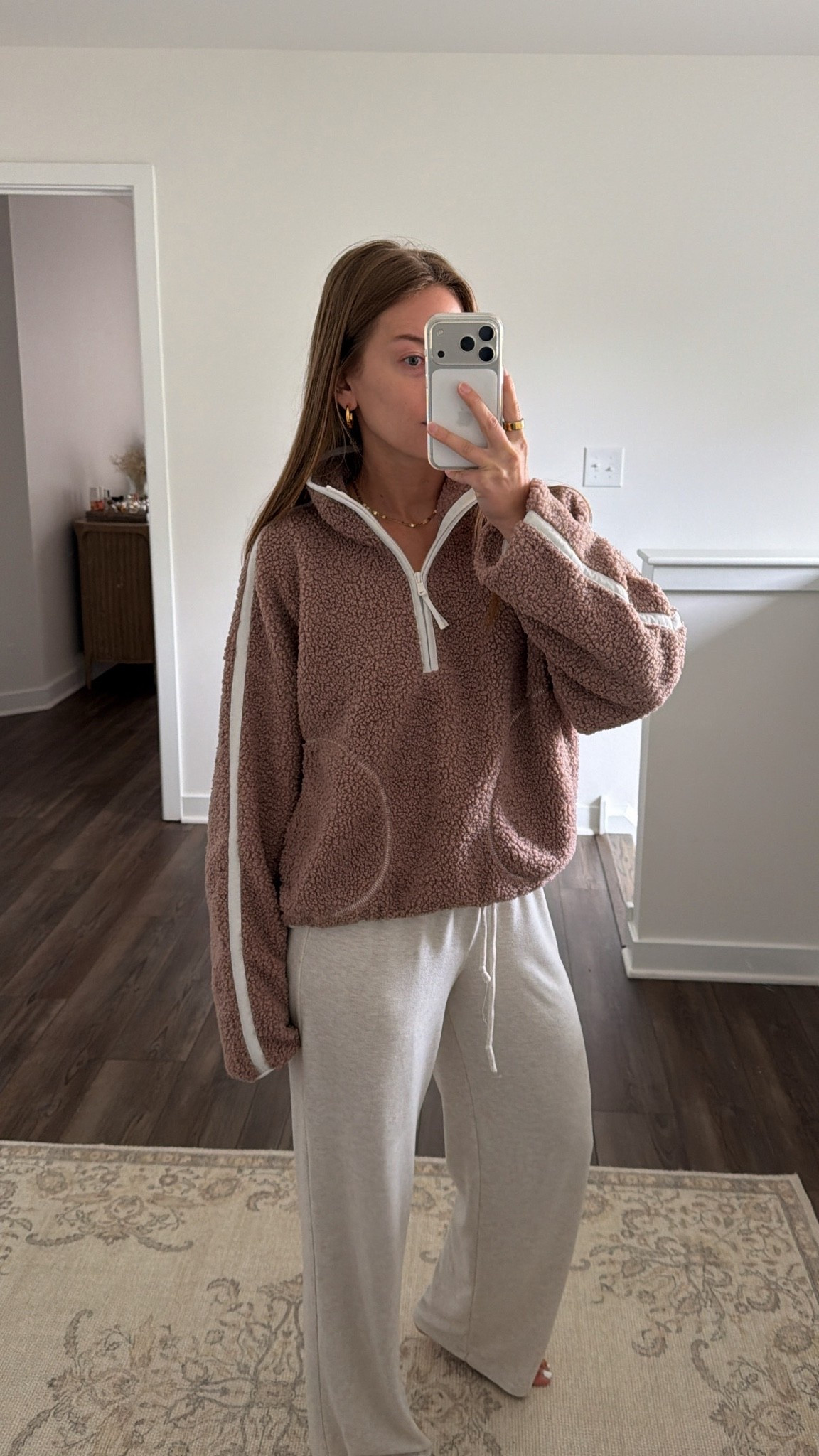 10/5/26 Cozy Fall Loungewear 🍂🤎

The kind of outfit I want to live in all fall 🤎 Linking this cozy @OldNavy fleece (M) — second year buying it because I loved last year’s so much — with my go-to @Aritzia Recharge pants.
Easy, cozy + perfect for slow mornings and days at home 🍂☕️